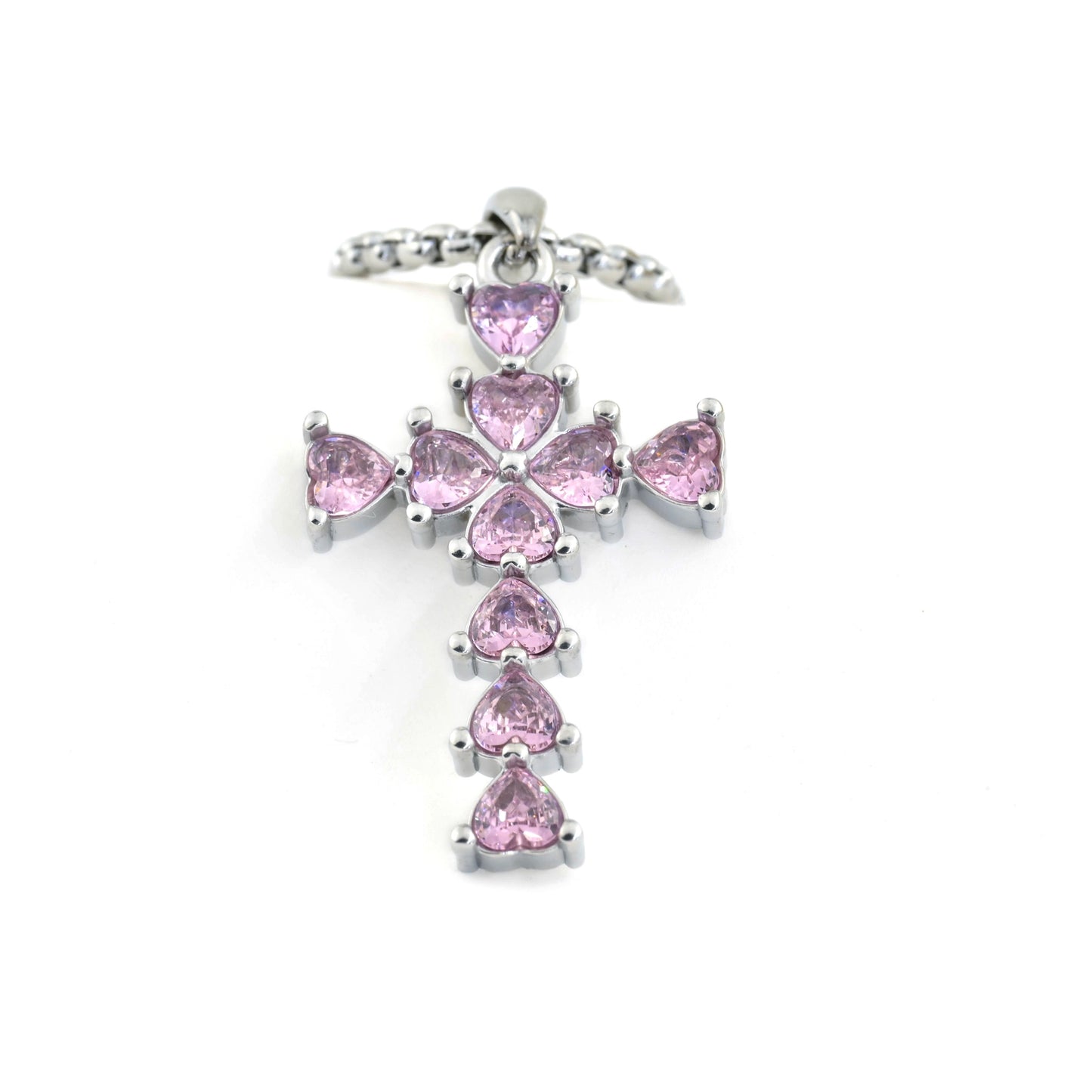Silver cross pendant with pink gemstones on a white background