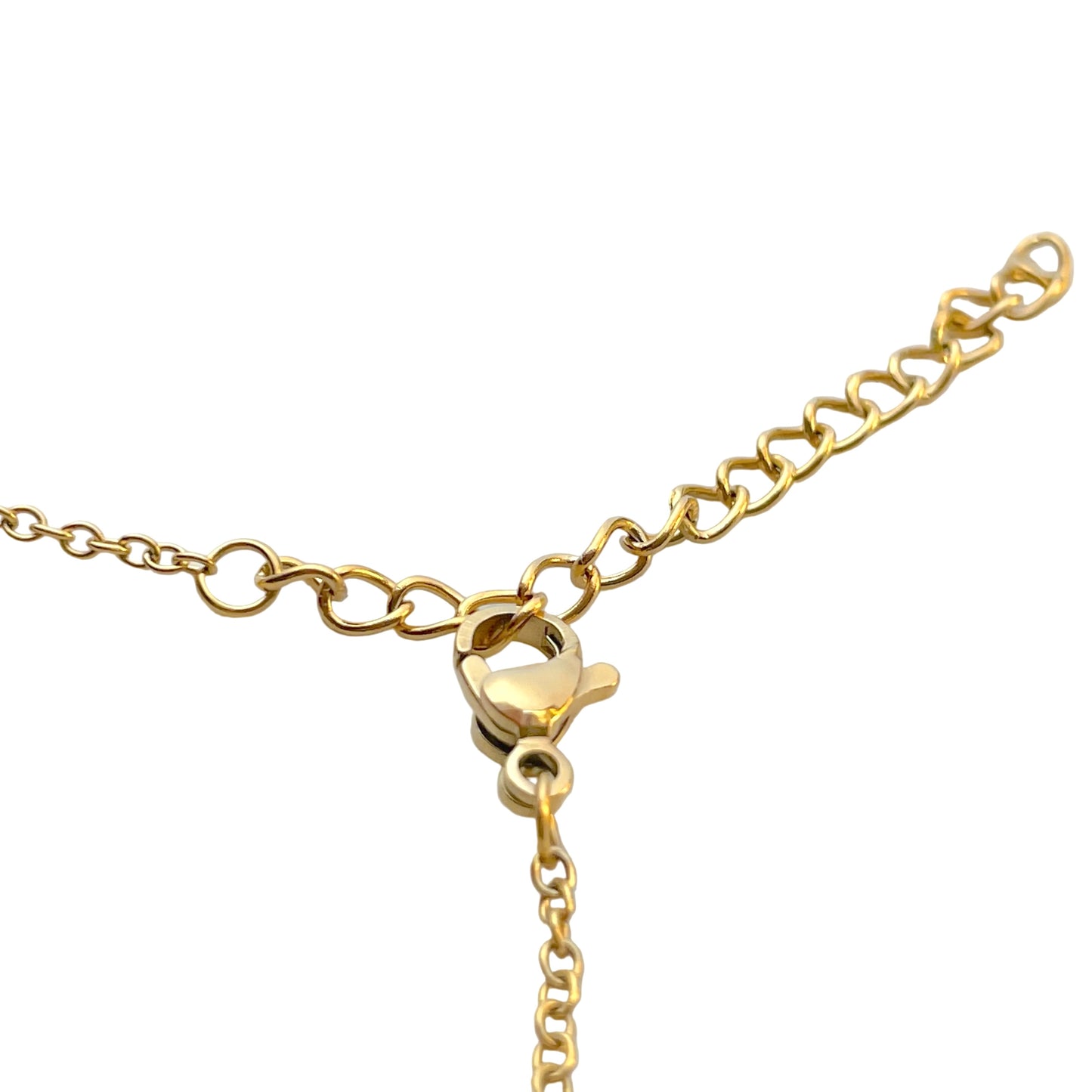 Close up view of the clasp area of gold initial necklace showcasing the lobster claw clasp and extender on a white background