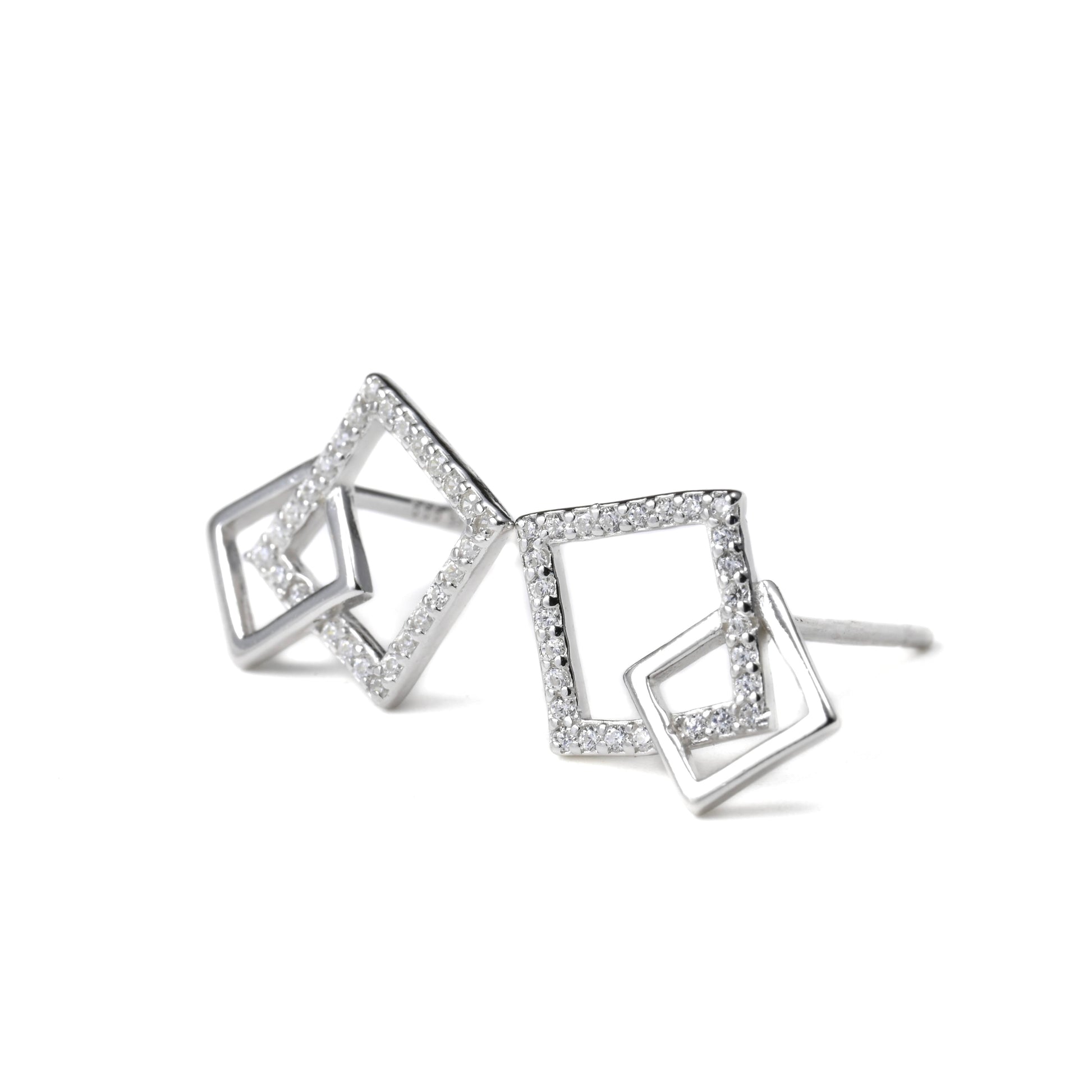 Pair of silver interlocking squareearrings with clear stones on a white background