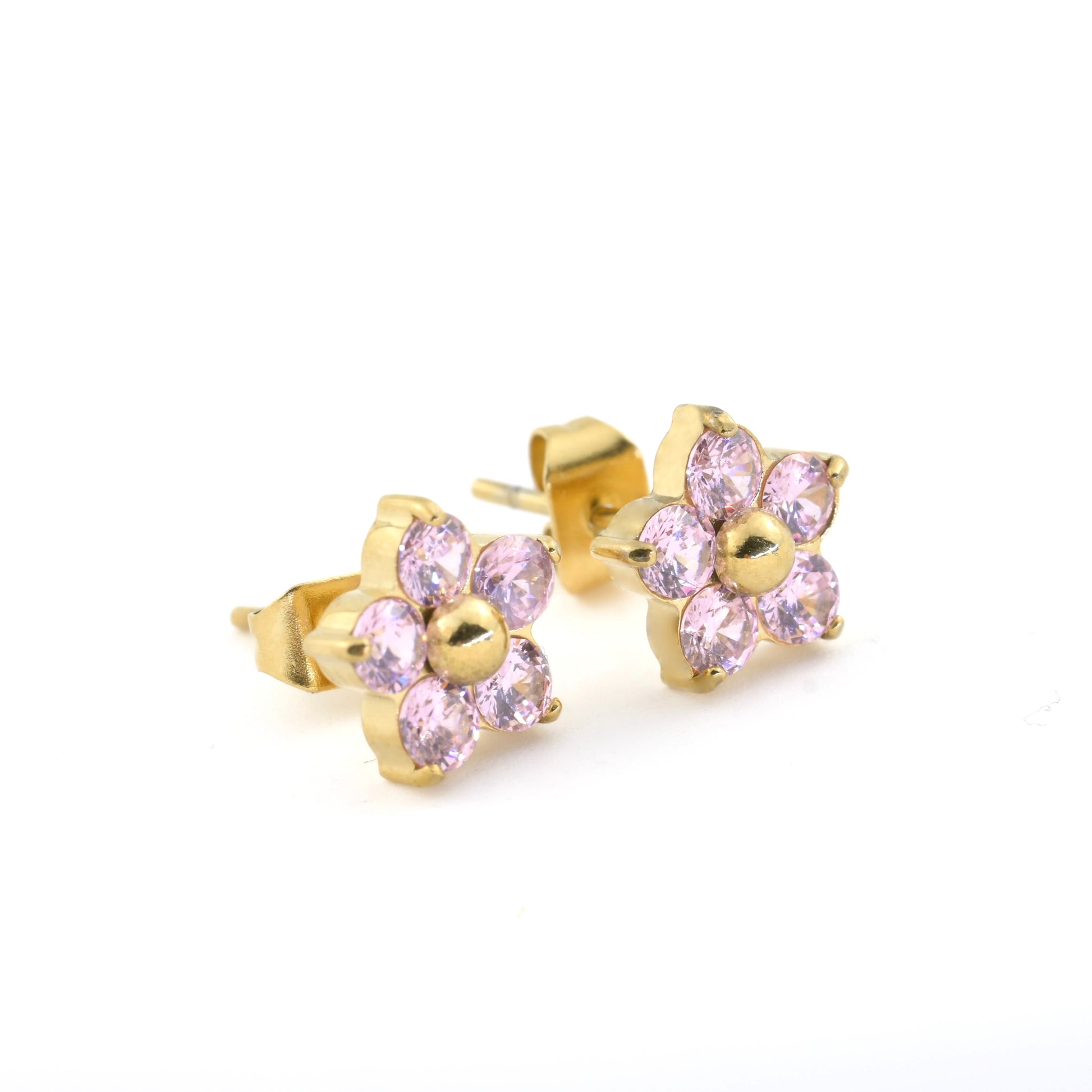 Gold flower-shaped earrings with pink gemstones on a white background