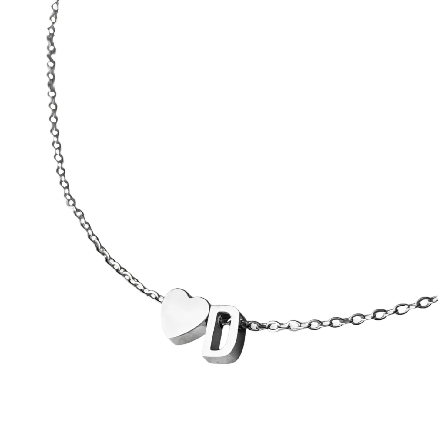 Silver necklace with a flat heart and letter 'D' pendants on a white background