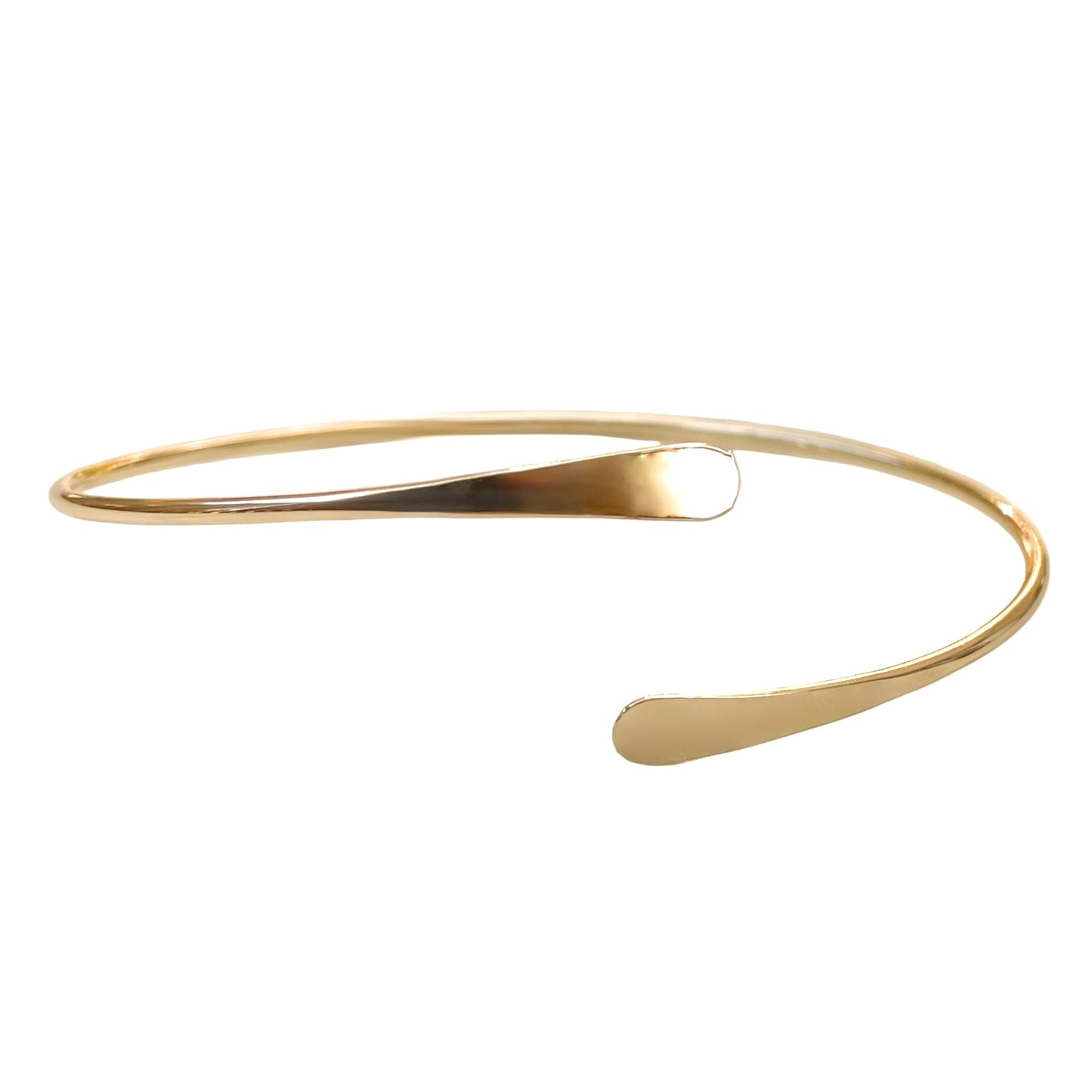 Delicate gold arm cuff on a white background