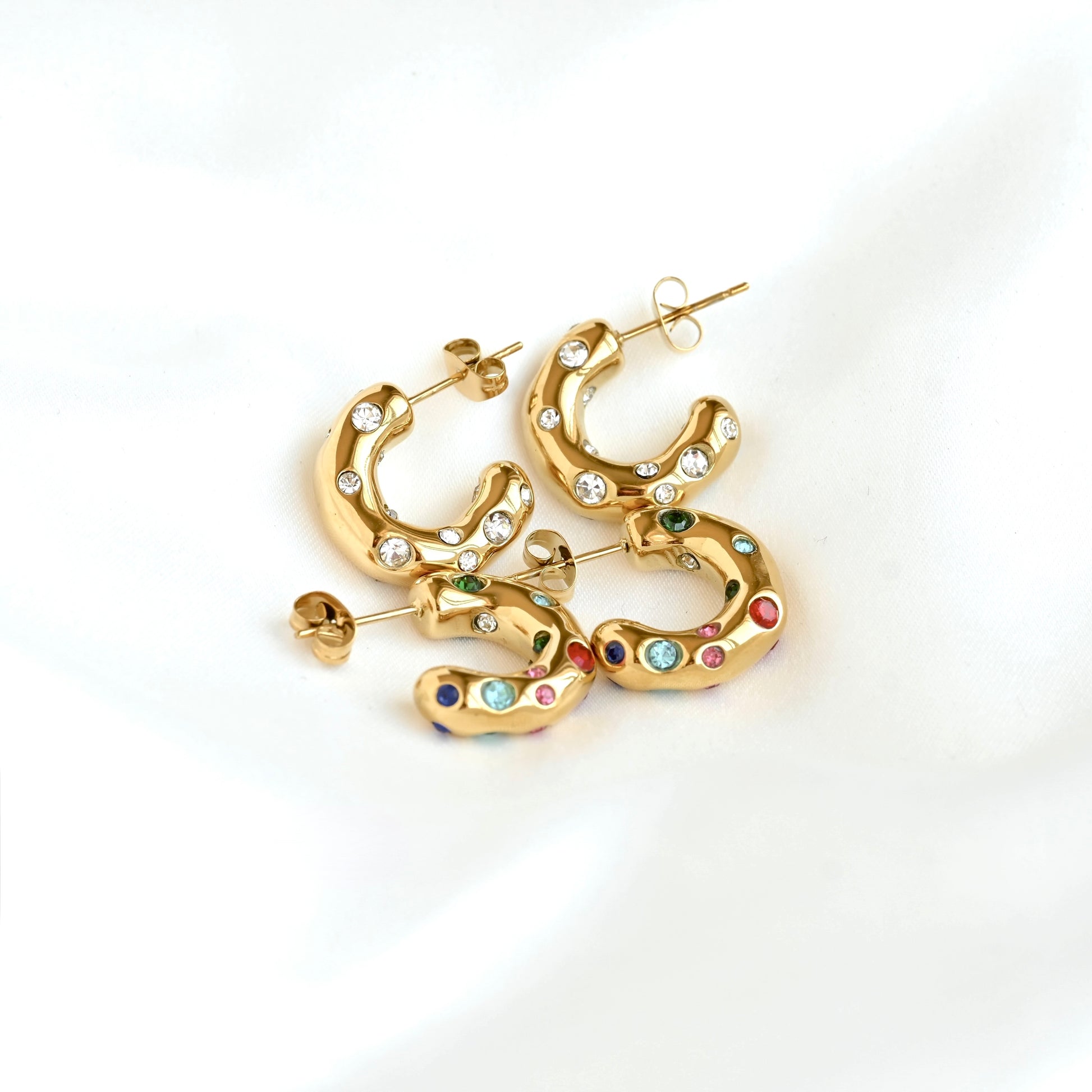 Bubble shaped C hoops embellished with all clear stones, and multicolor stones including blue, green, pink and ruby.