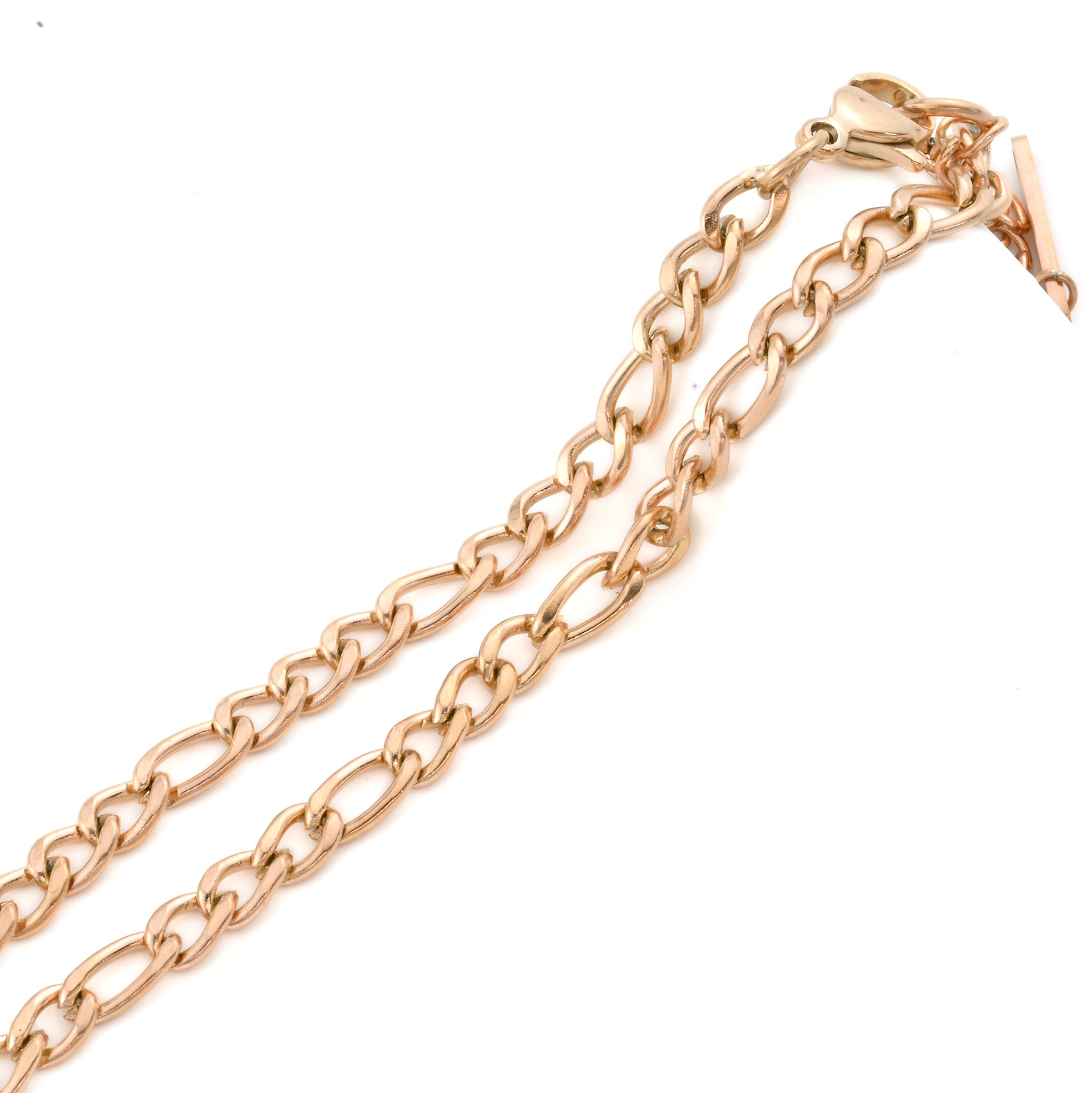 Rose gold figaro chain on a white background