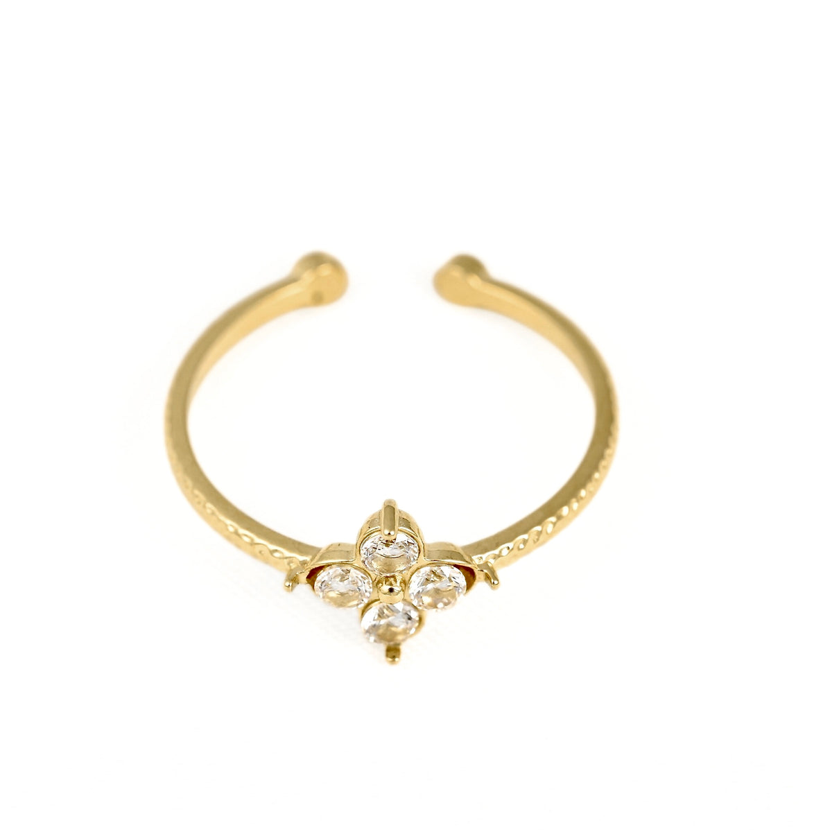 A gold-plated open ring bangle featuring a small floral charm at the center, adorned with three clear rhinestones, set against a plain white background.