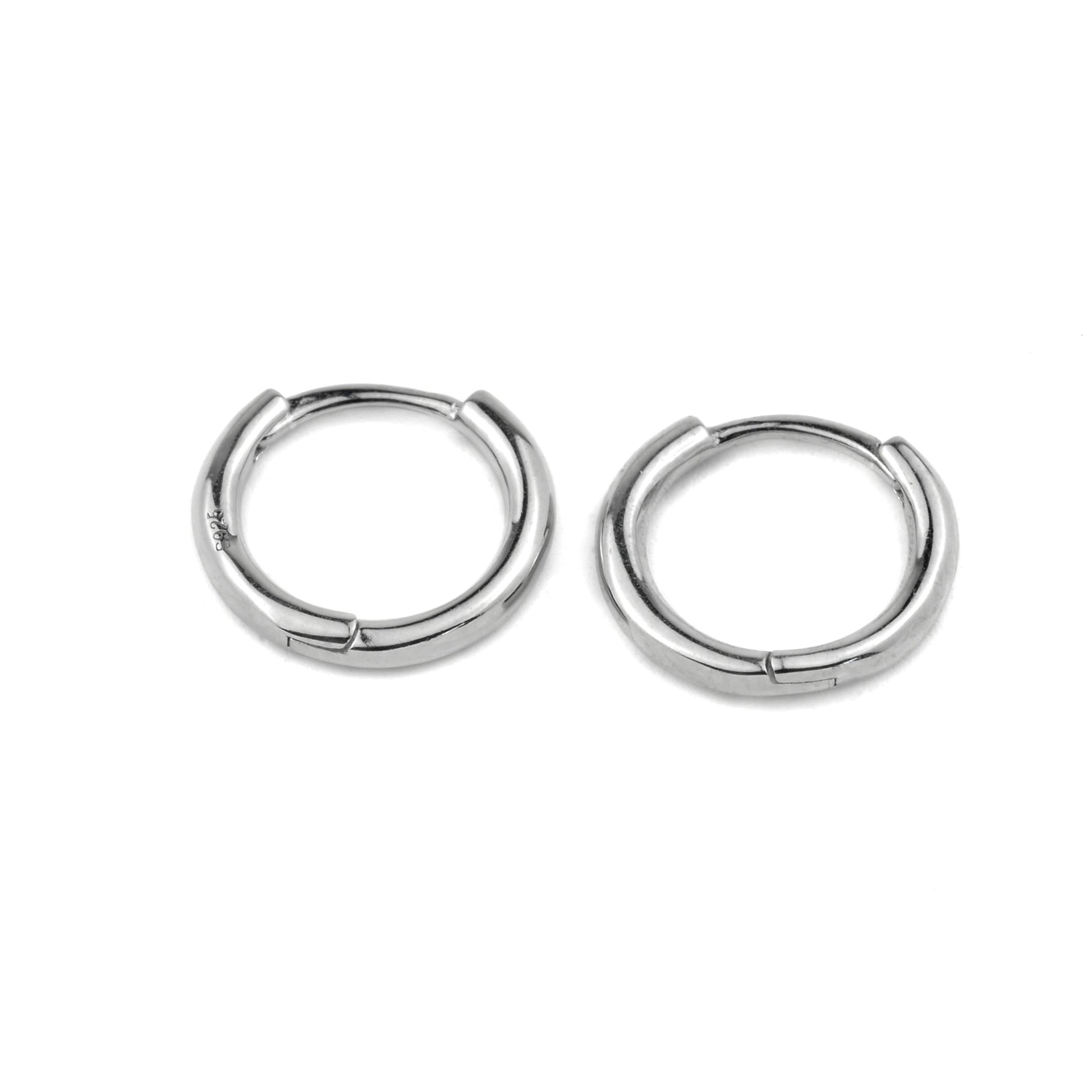 Pair of silver classic hoop earrings on a white background