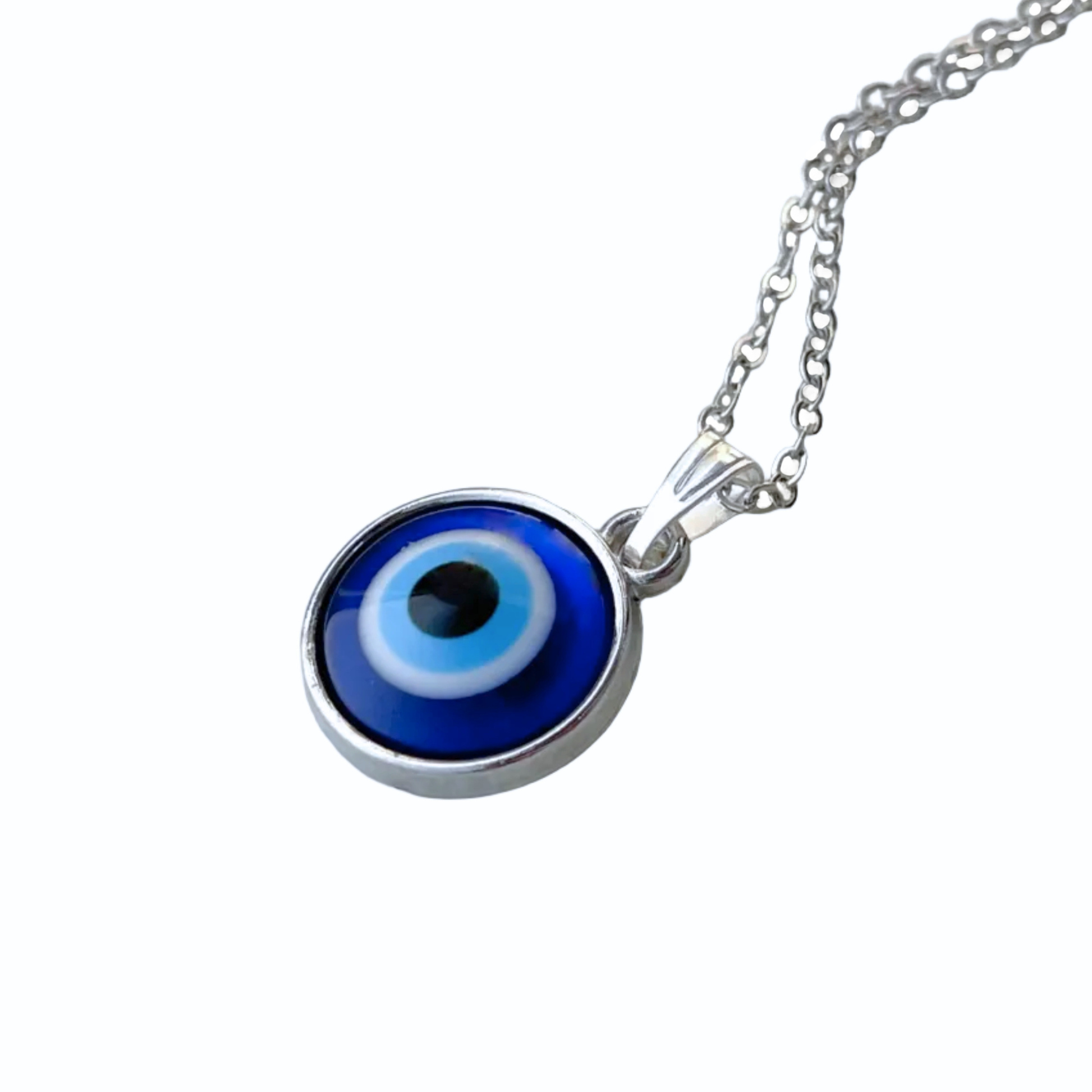 Blue evil eye pendant on a silver chain against a white background