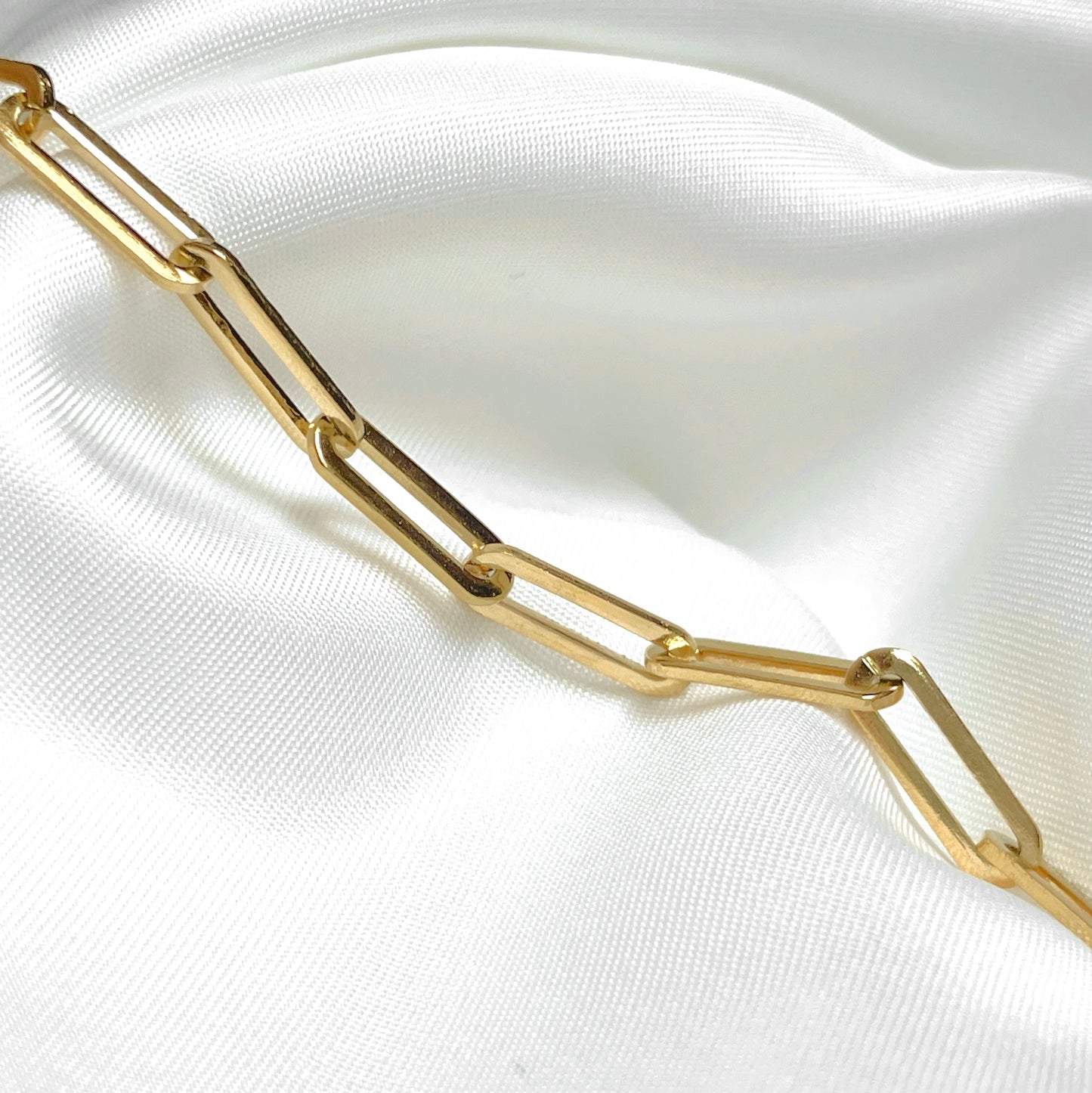 close up view of gold paperclip links