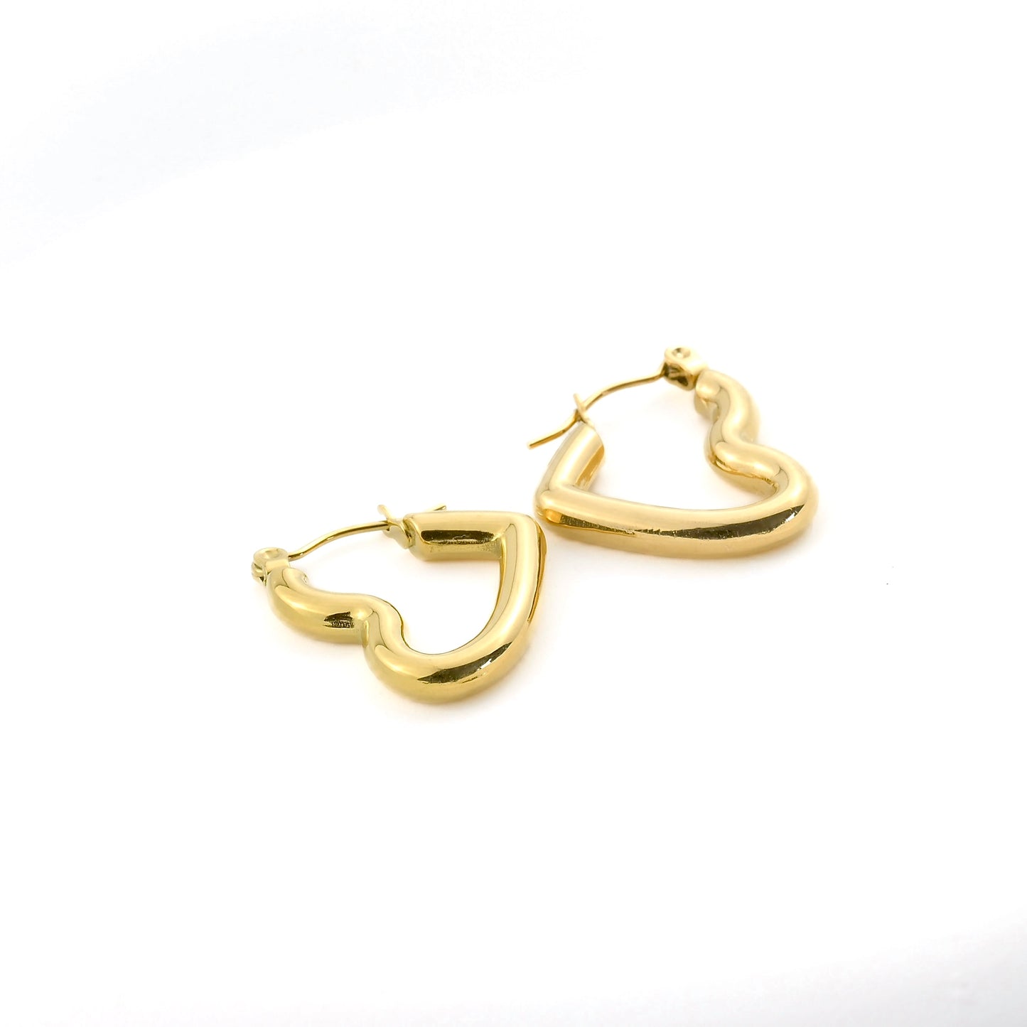 Gold heart-shaped hoop earrings on a white background