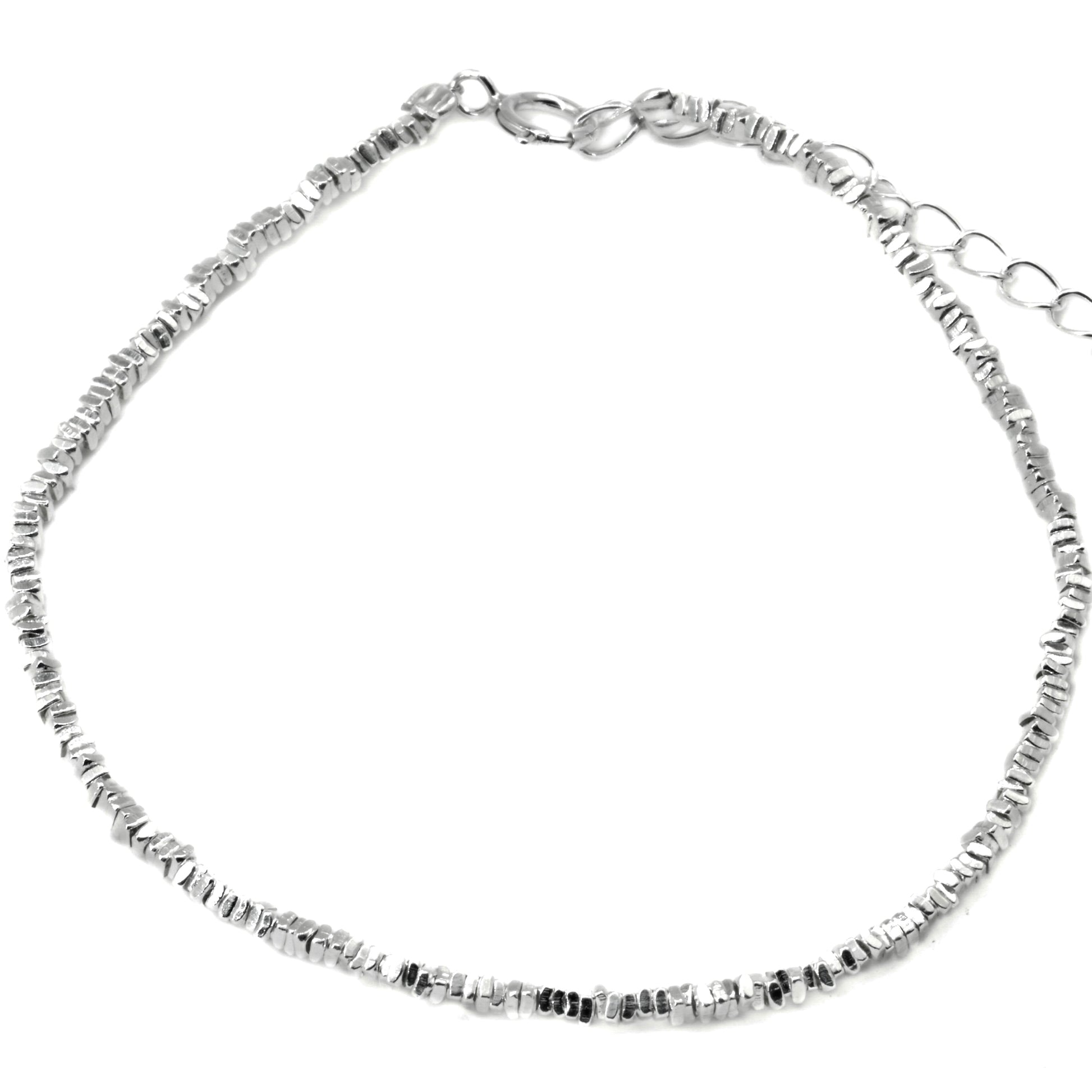 Silver bracelet with small beads, a spring ring clasp and extender on a white background
