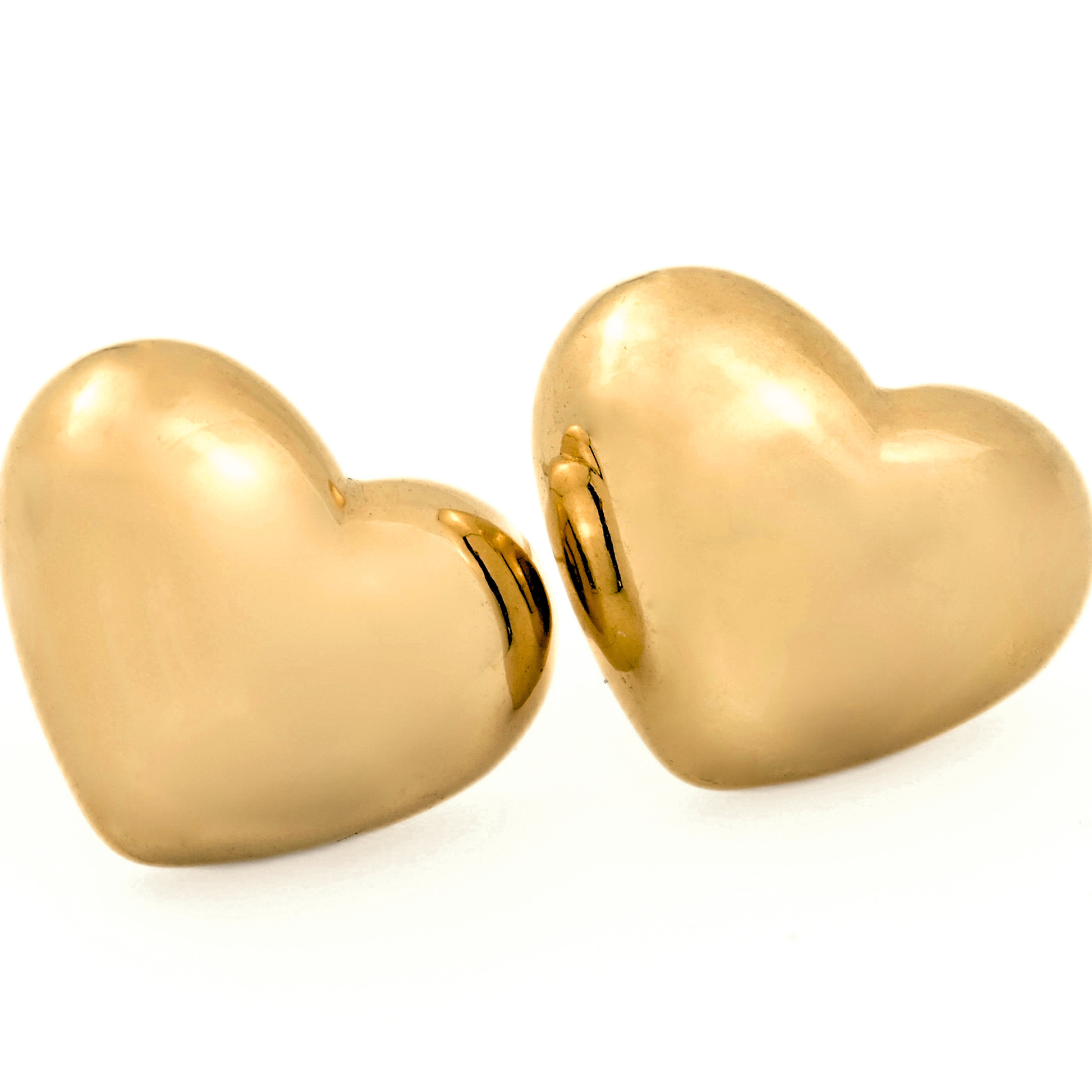 Gold puffed heart studs on a white background