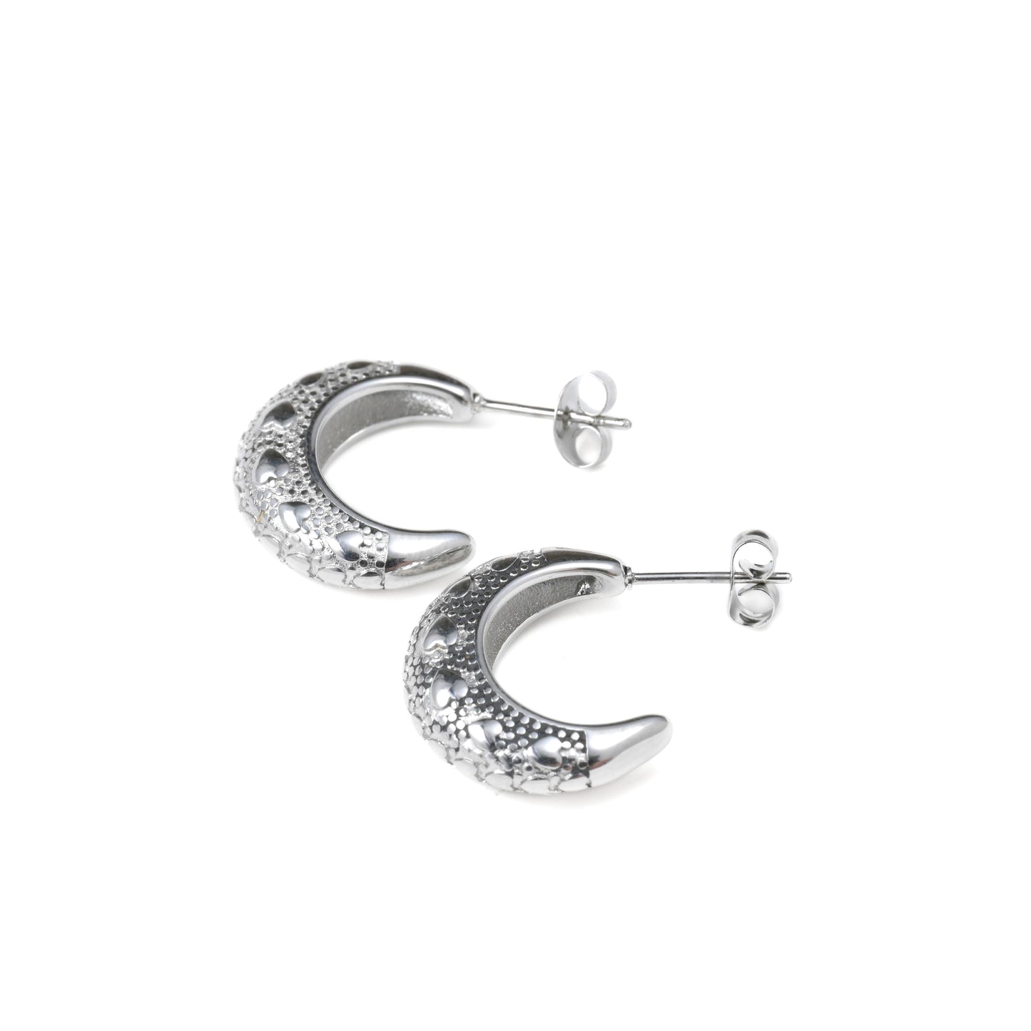 Silver crescent moon earrings on a white background