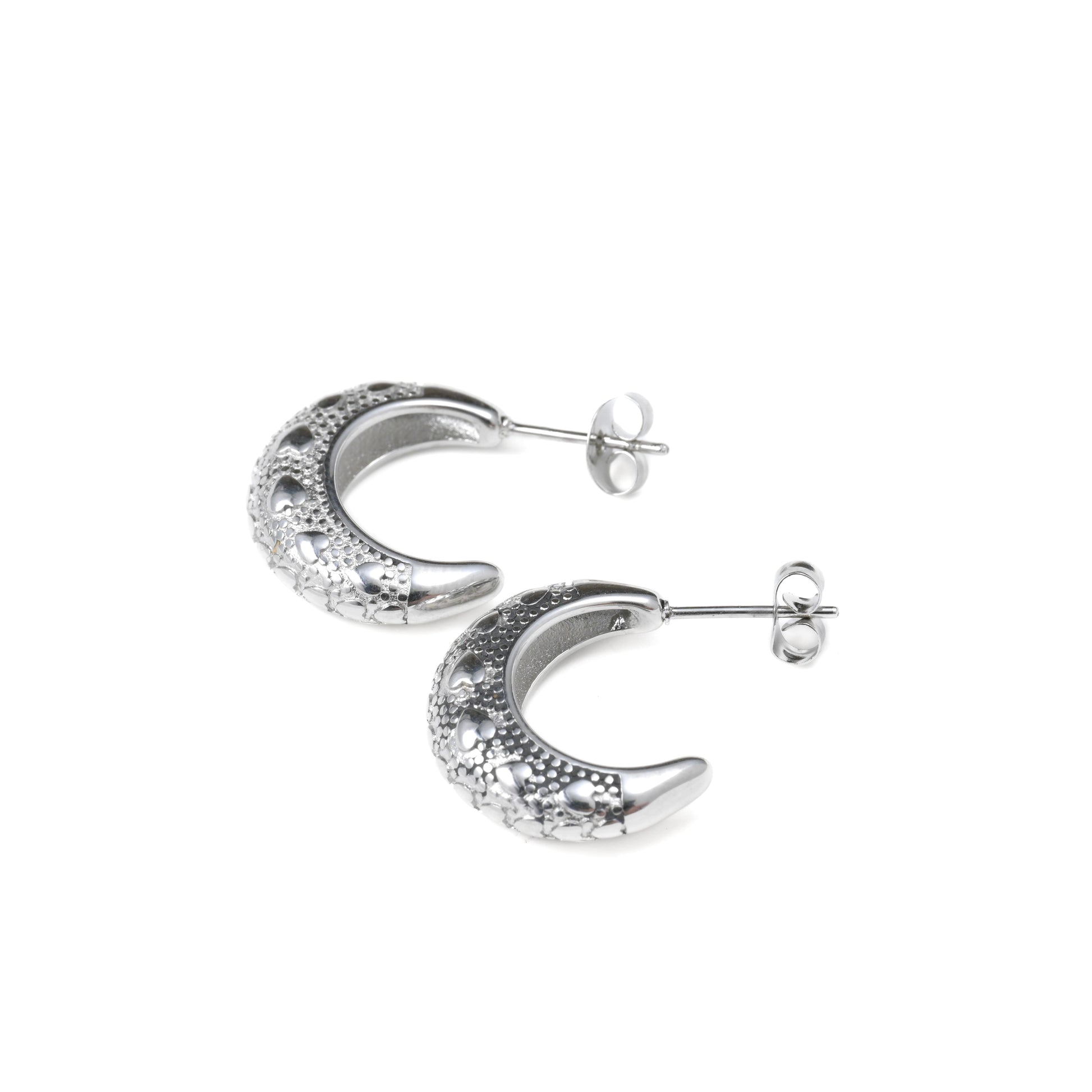 Silver crescent moon earrings on a white background