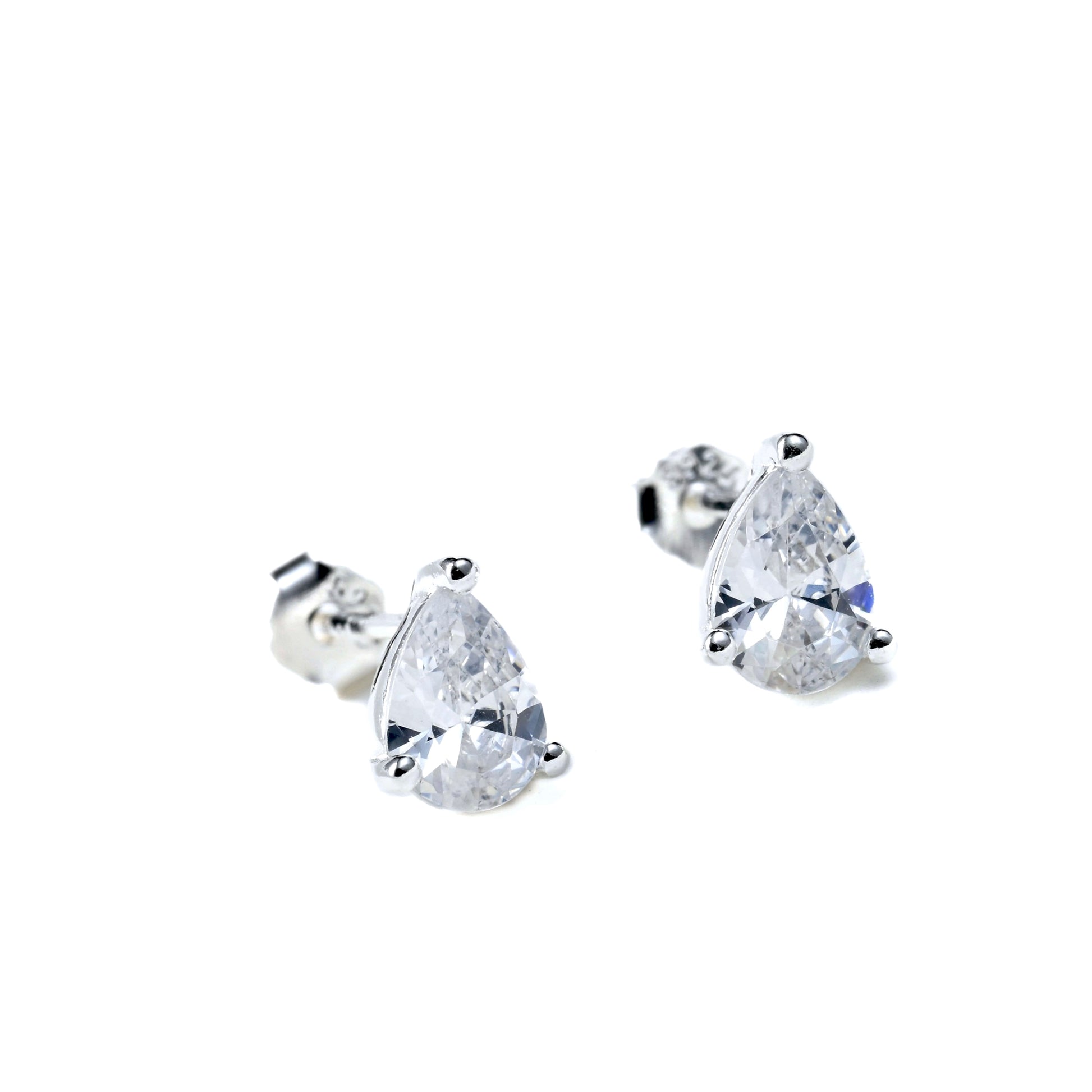 Pair of silver teardrop-shaped stud earrings on a white background