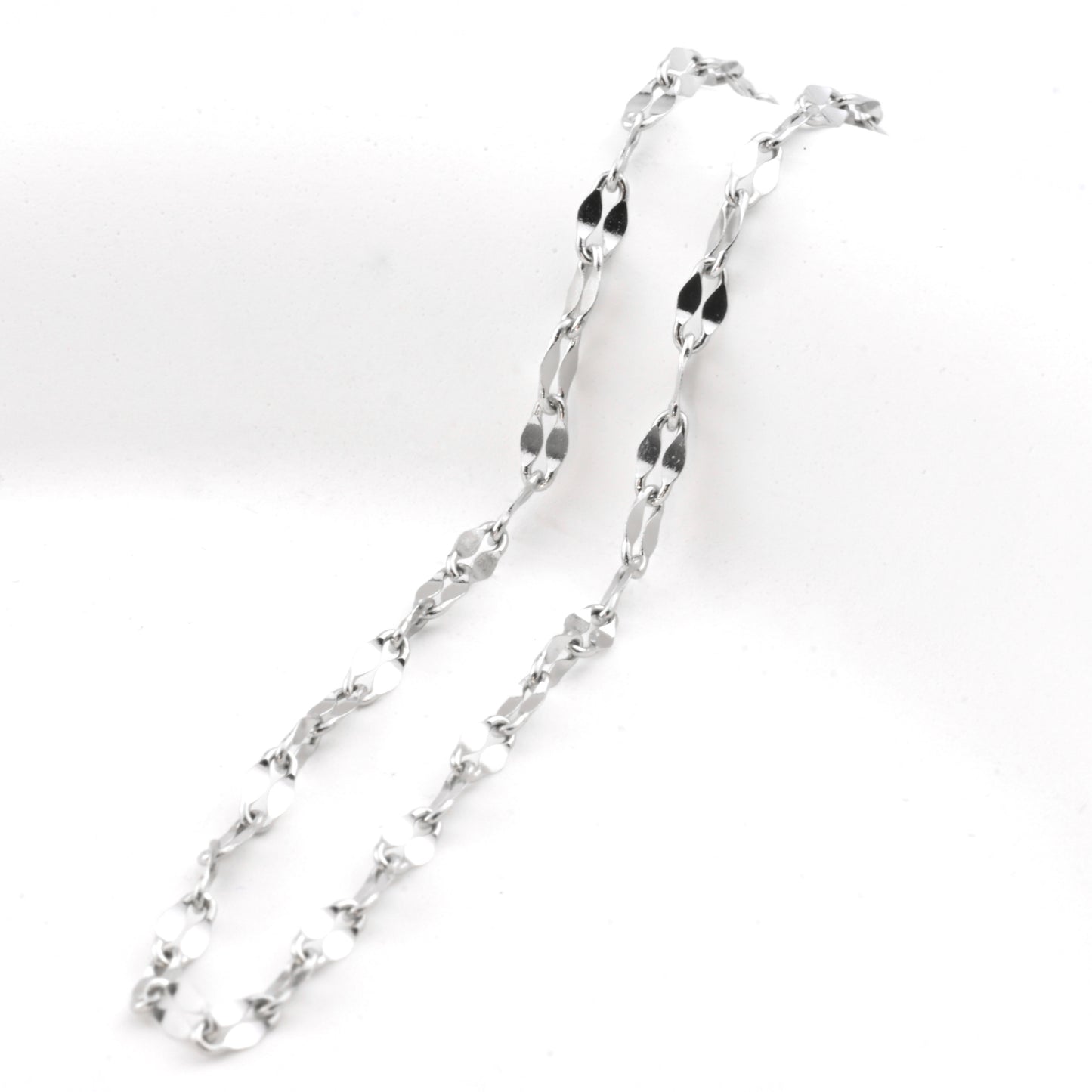 Silver sequin chain anklet on a white background