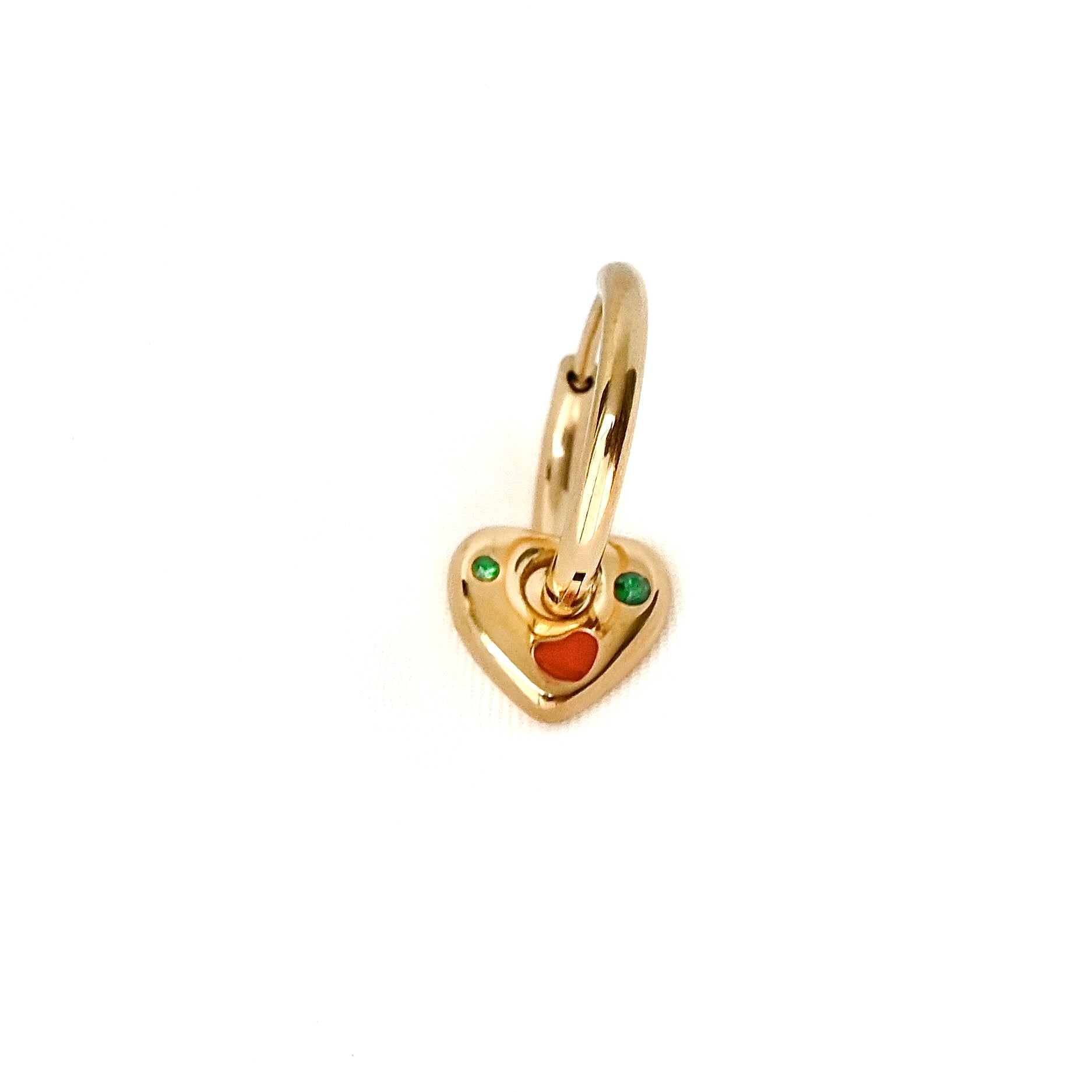 Gold heart charm earrings with colorful stones on a white background