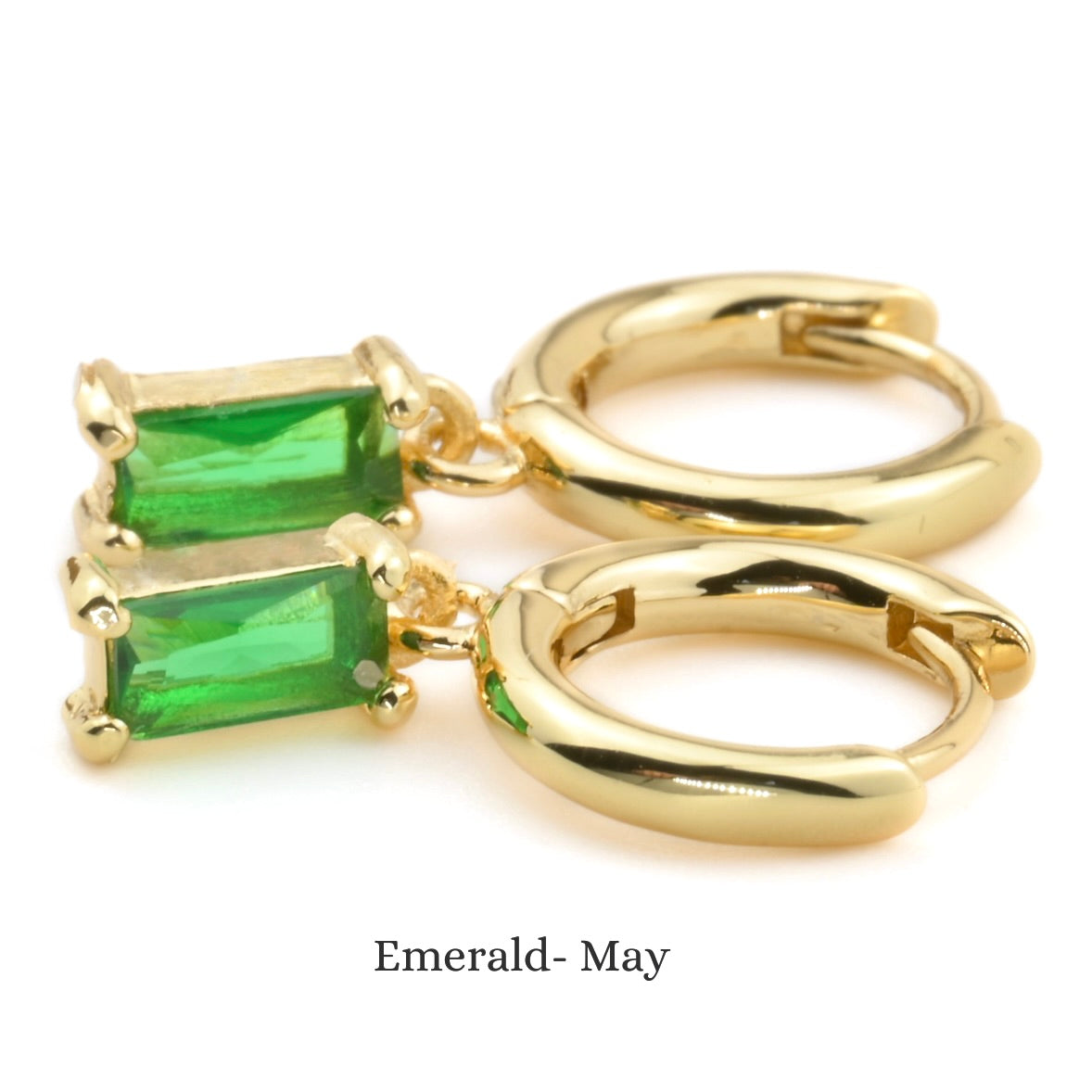 emerald green gemstone hoops on a white background
