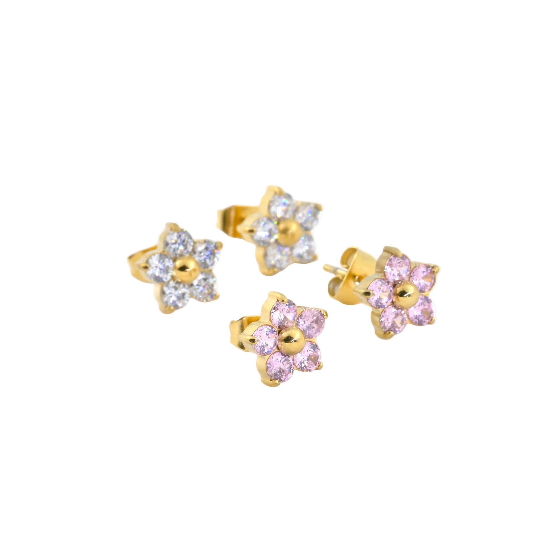 Two pairs of gold and gemstone flower stud earrings on a white background