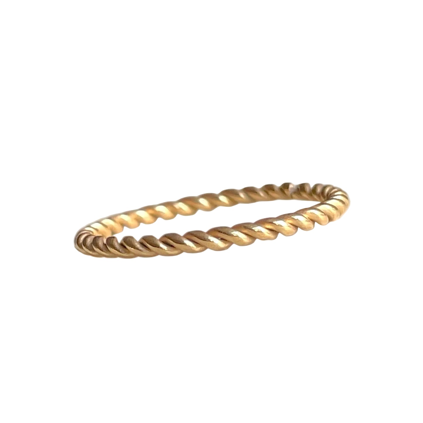 Super slim twisted gold ring on a white background