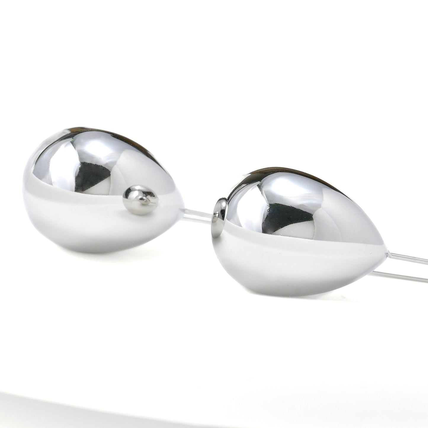 close up to the teardrop part of the hook earrings on a white background