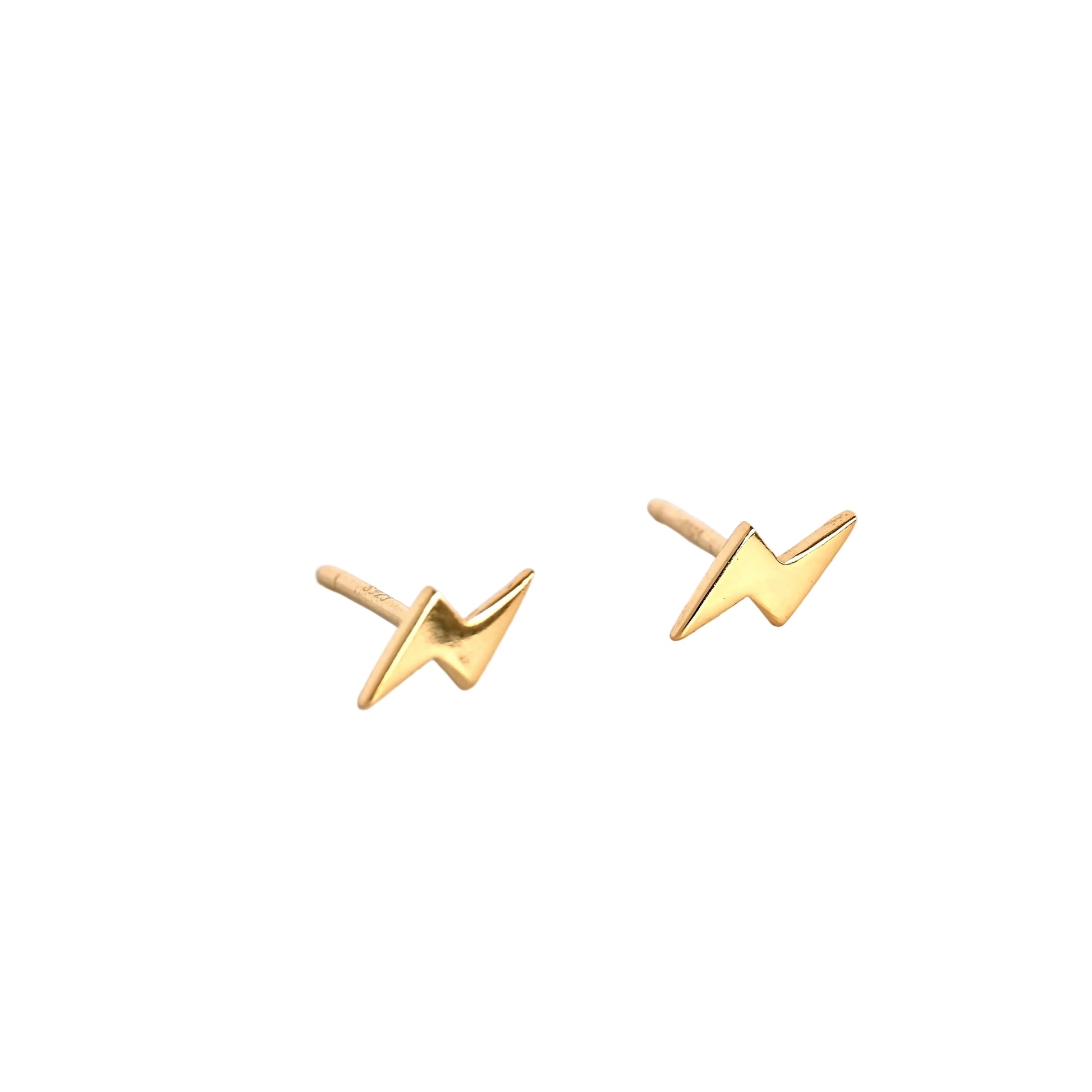 Gold lightning bolt earrings on white background