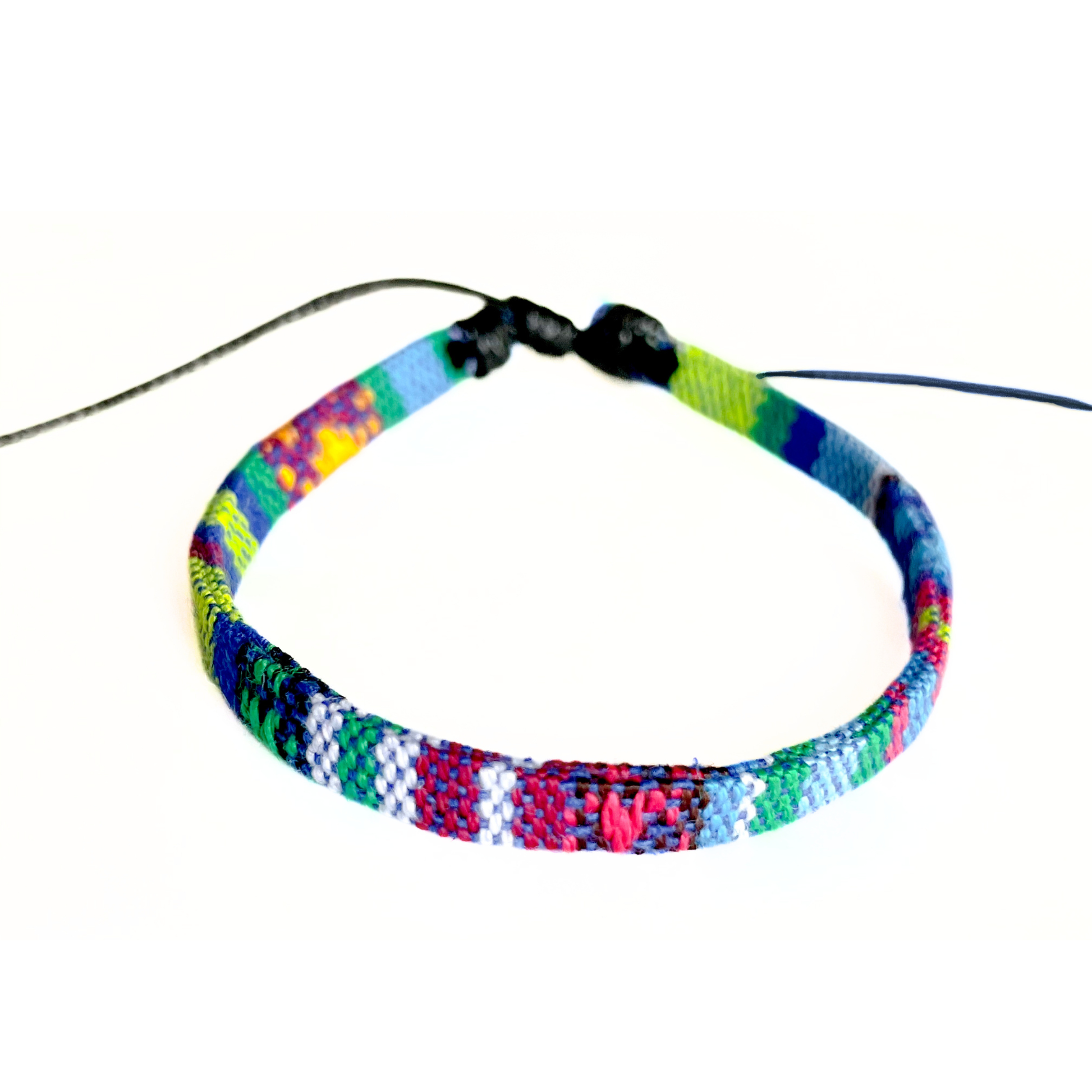 Multicolored woven anklet bracelet with a black sliding knot on a white background