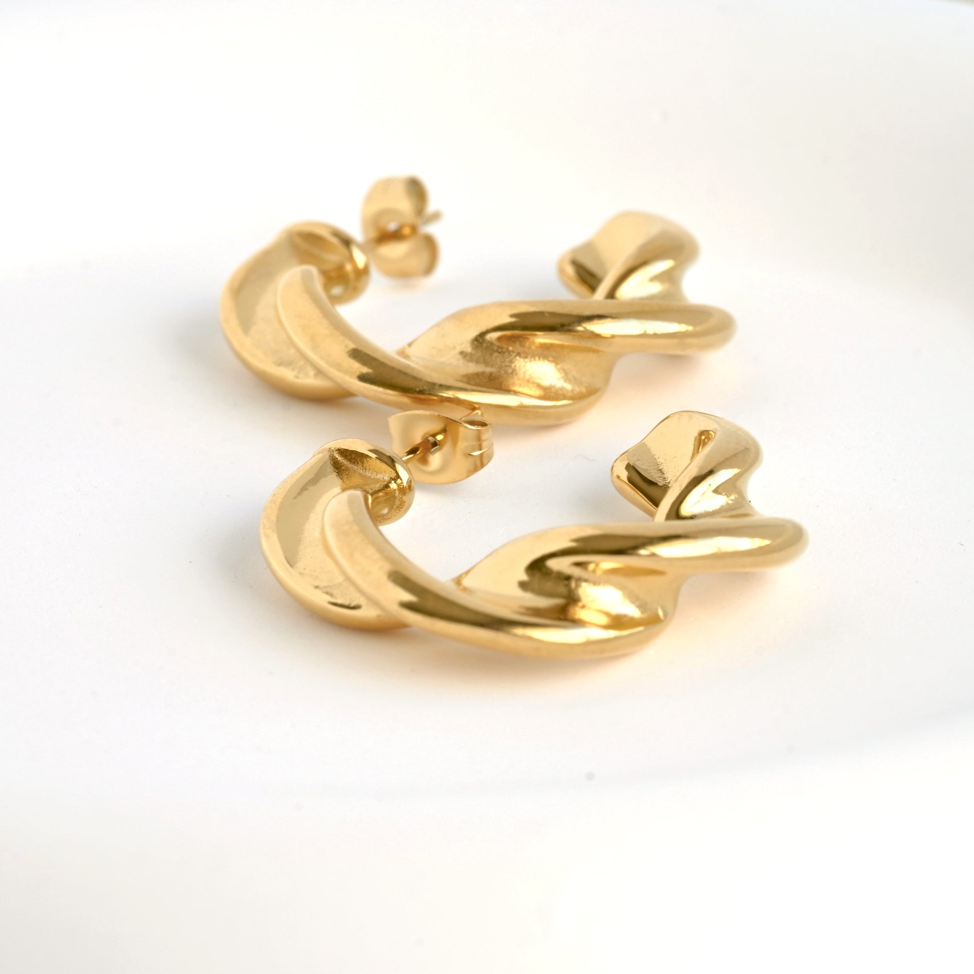 another close up view showing the thickness of the earrings