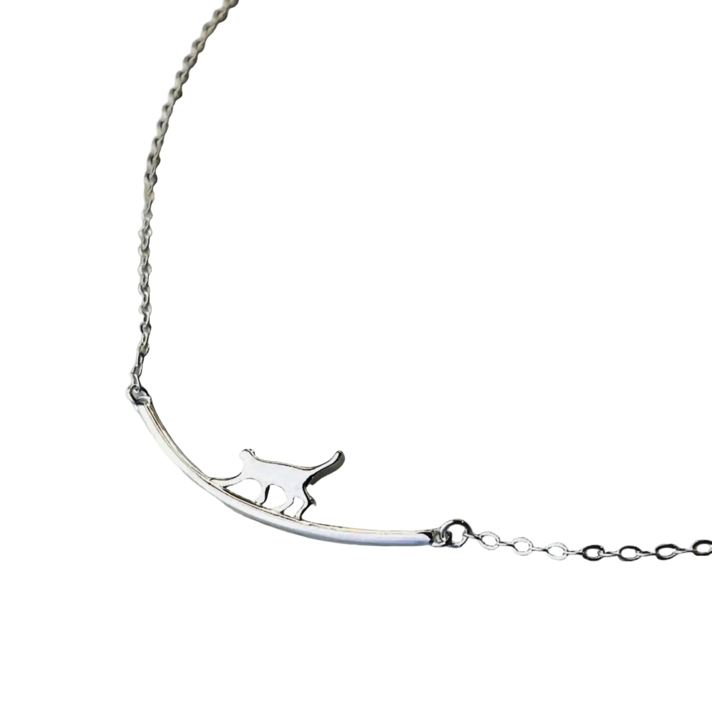 Silver necklace with a cat-shaped pendant on a white background