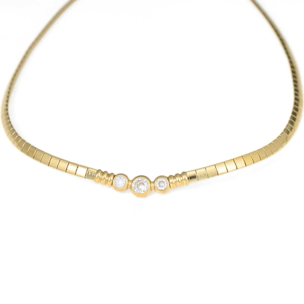 A yellow gold snake chain necklace featuring three bezel-set round clear stones in the center, displayed on a clean white background.