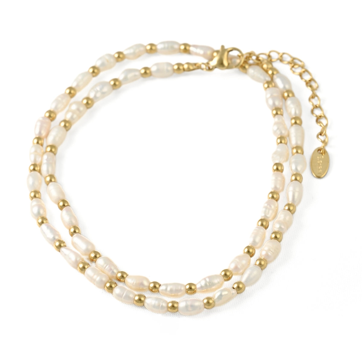 A freshwater pearl necklace with gold beads and a gold clasp, displayed on a clean white background.