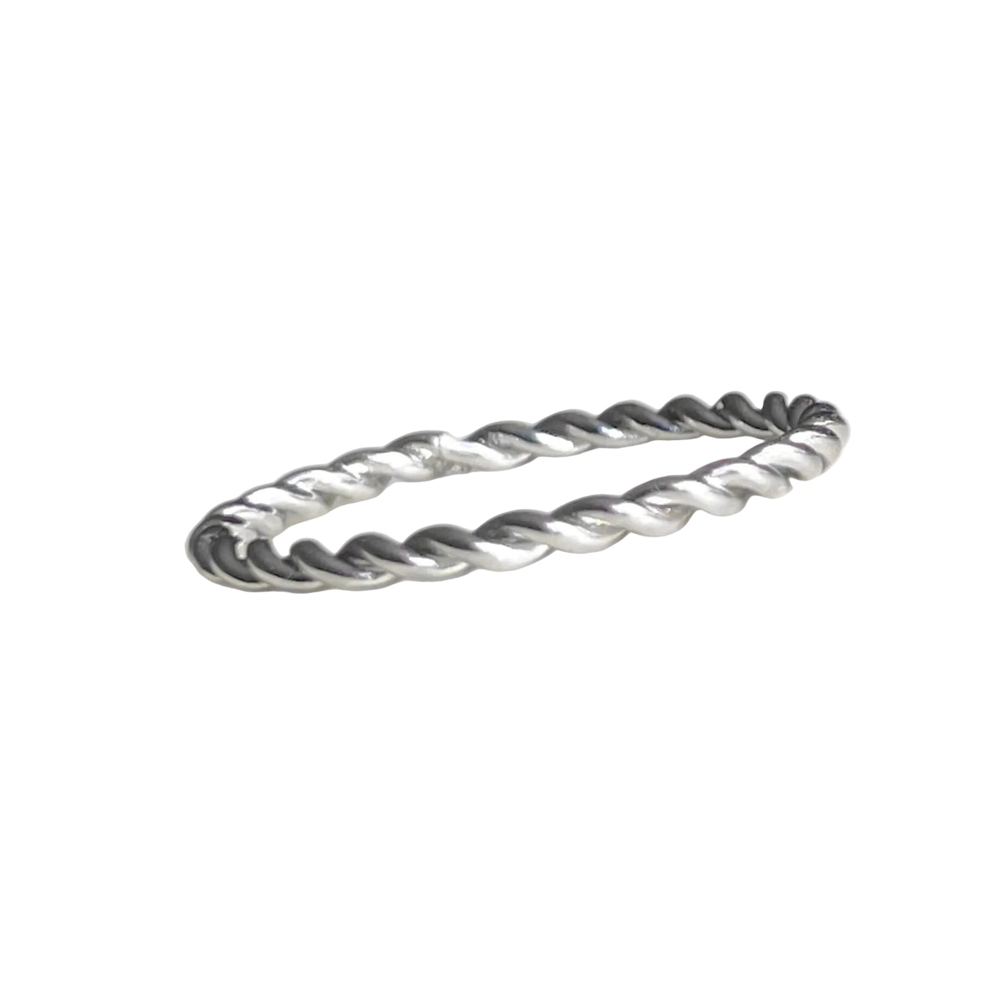 Silver ring with a twisted design on a white background