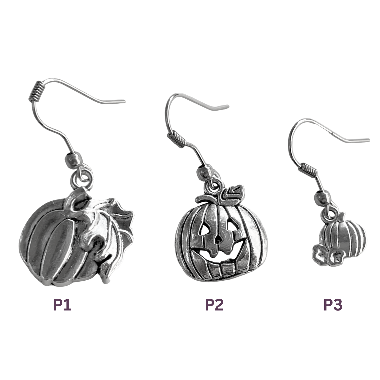 Three silver pumpkin earrings of different sizes on a white background