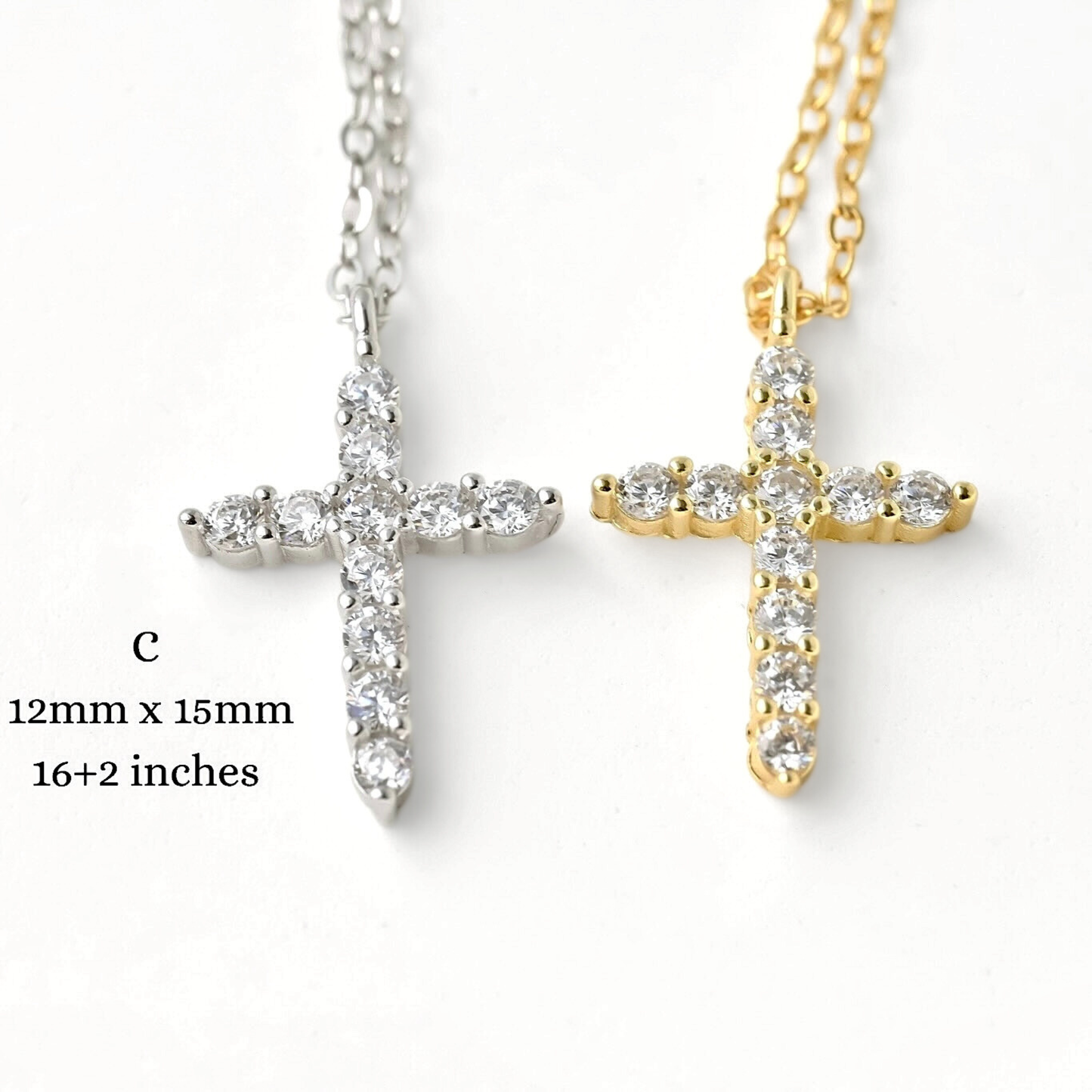 Two cross-shaped necklaces, one silver and one gold, with triangular edges, on a white background with size and length information.
