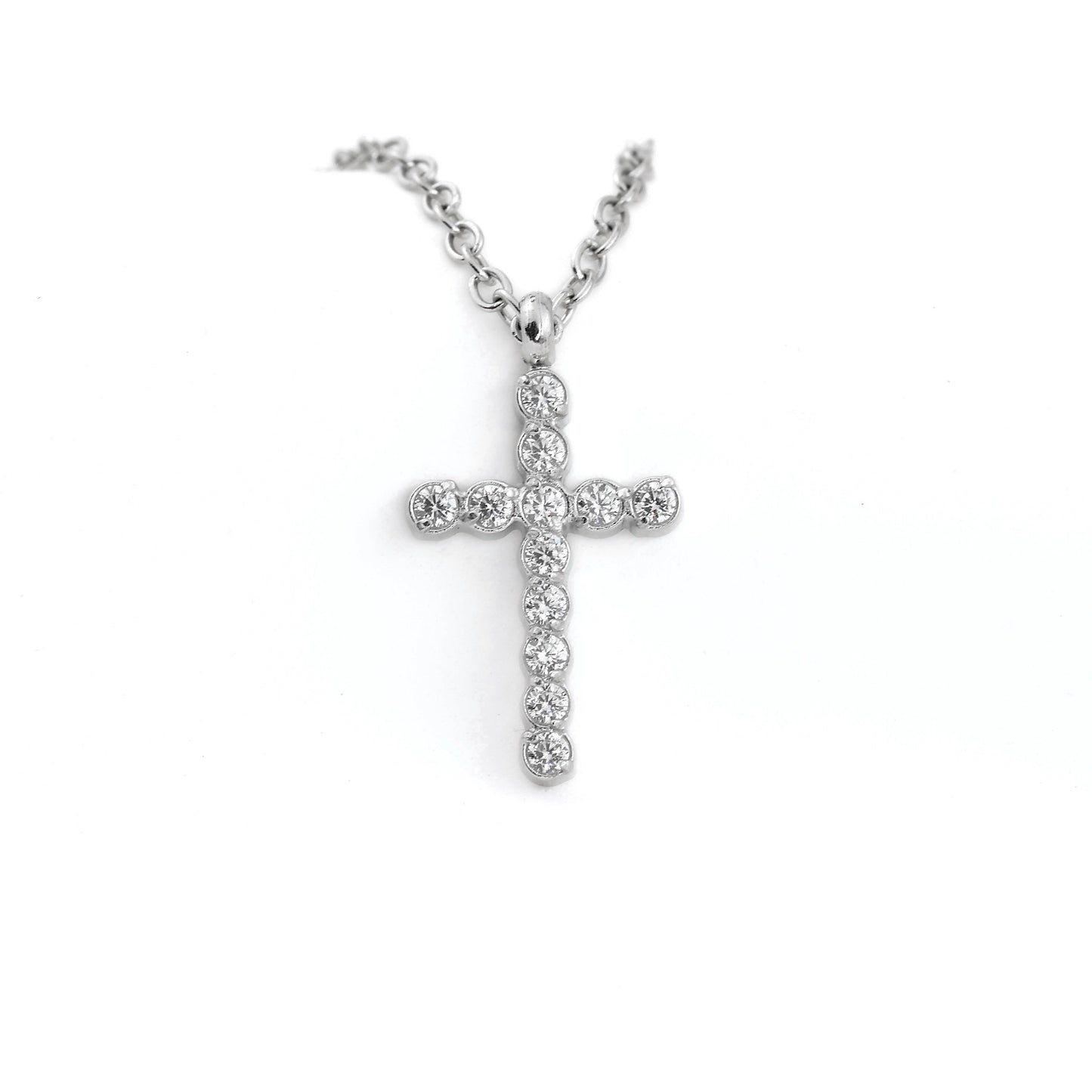 Front view of silver cross pendant necklace on a white background