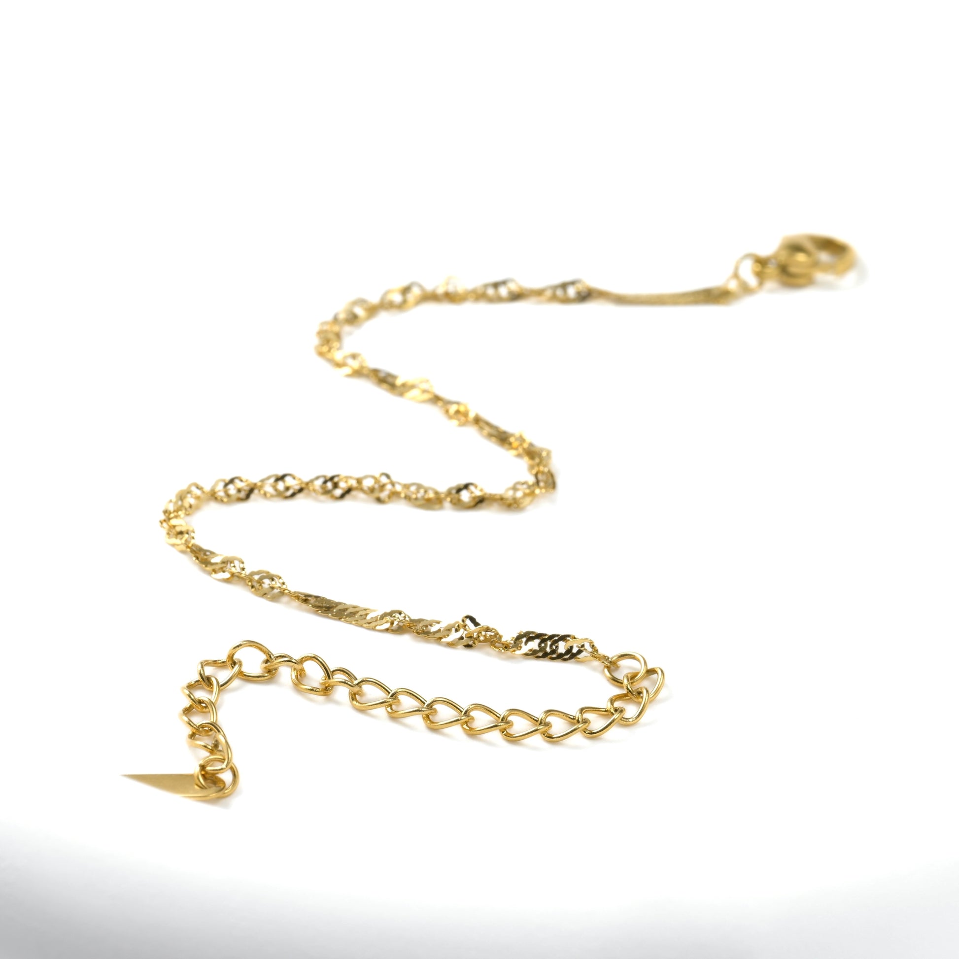 Gold chain necklace on a white background