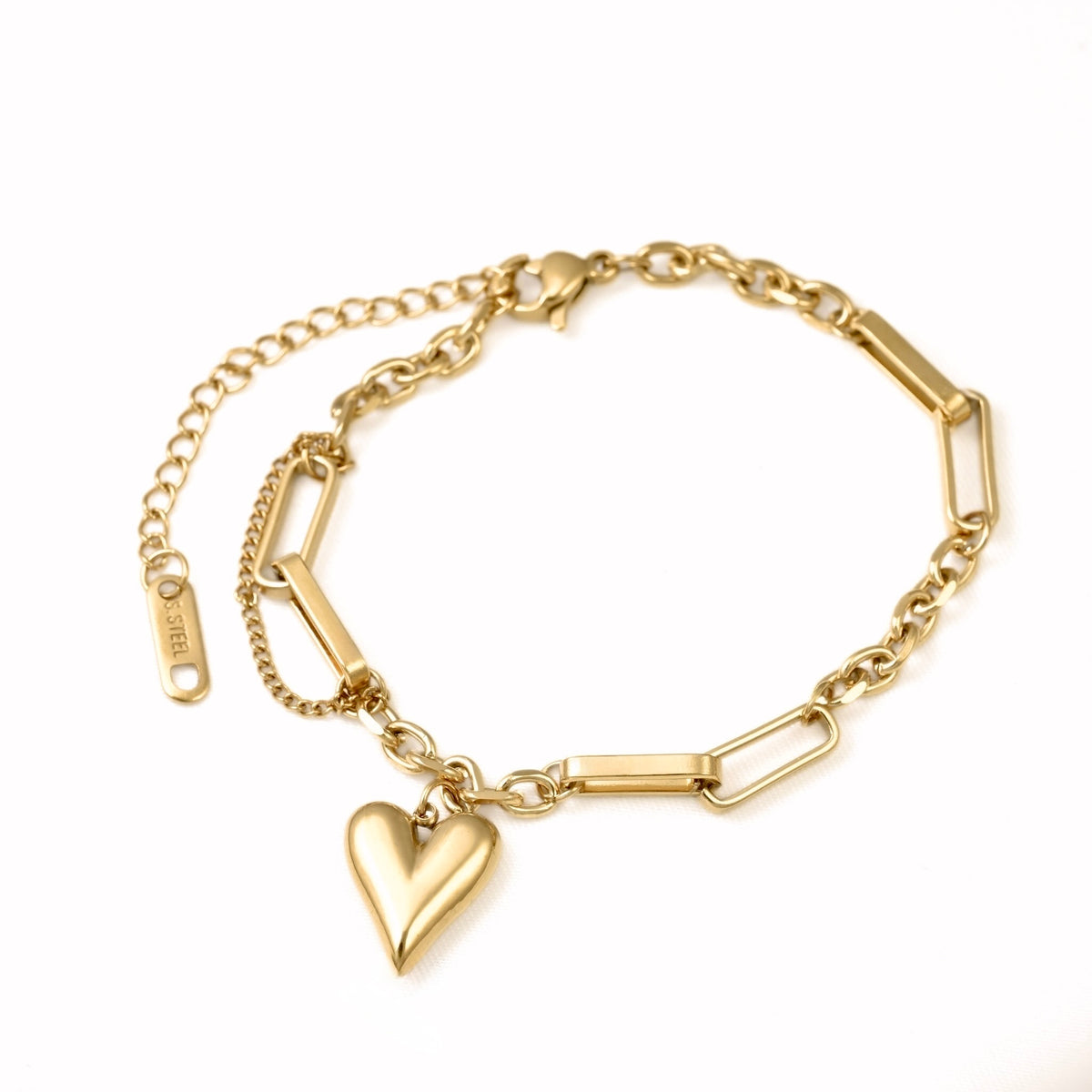 A gold-plated steel link bracelet with a heart-shaped charm, featuring a combination of chain links, bar links, and a dangling heart pendant, shown on a plain white background.