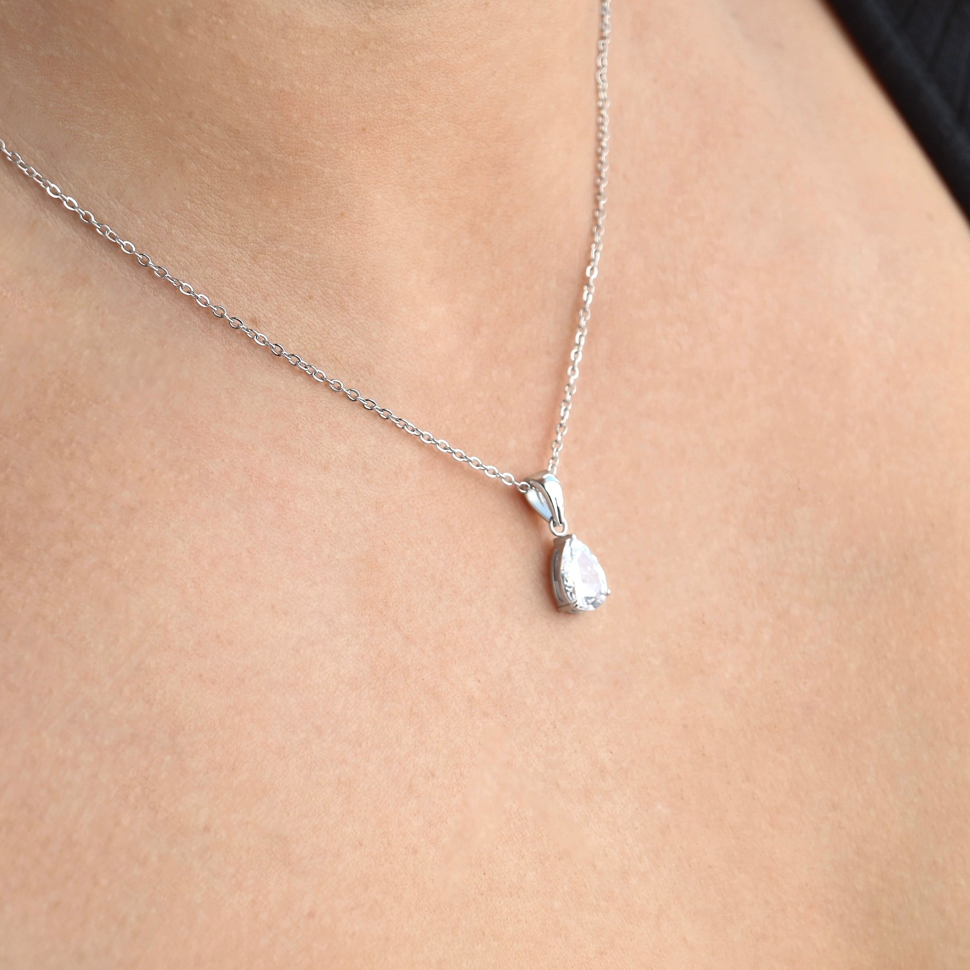 Silver teardrop pendant with clear gemstone