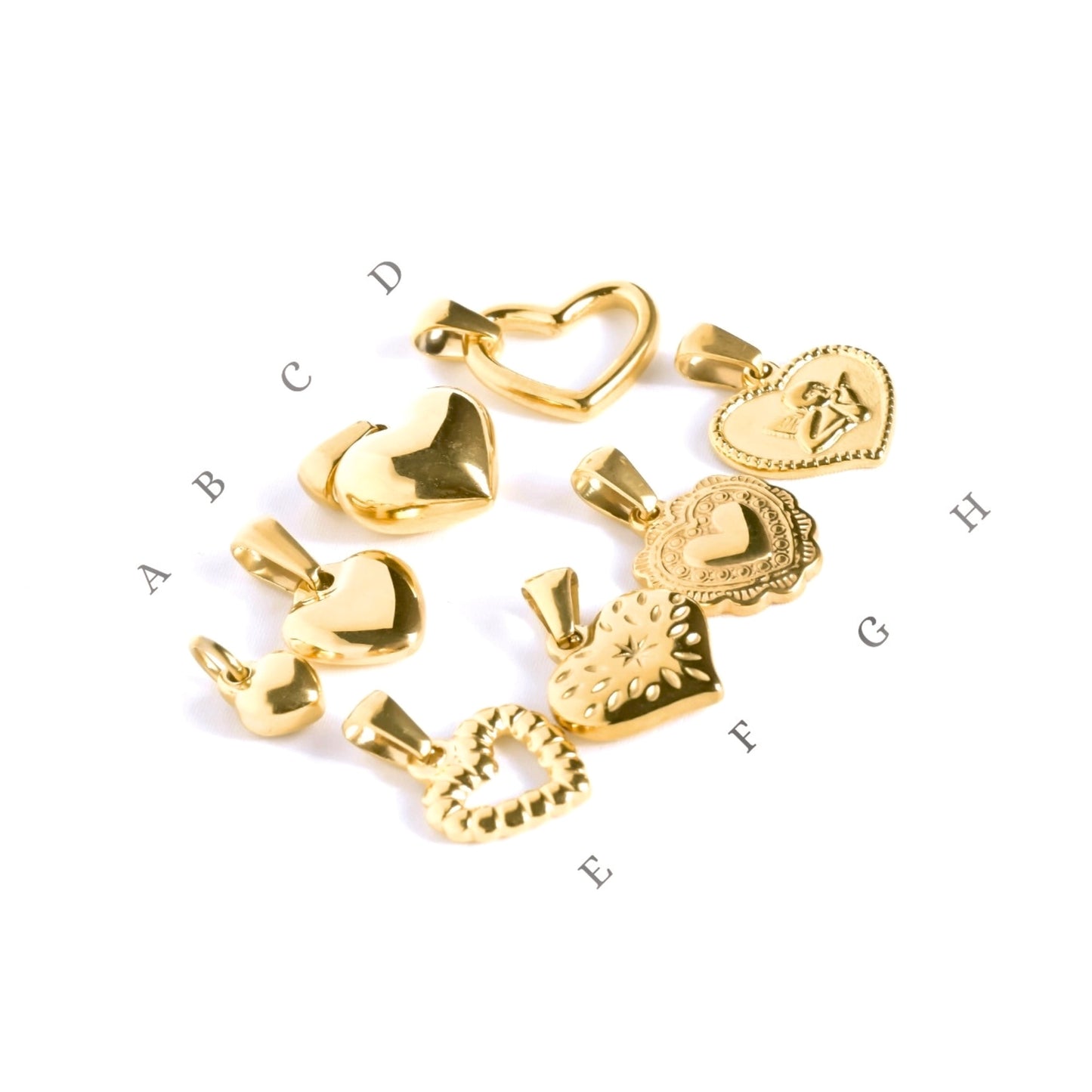 8 different typed of gold heart pendants on a white background