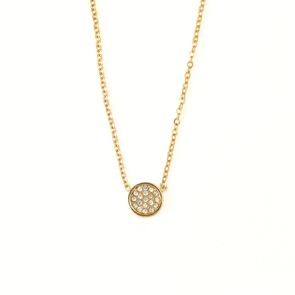 A delicate gold chain necklace with a small circular pendant paved with clear stones, displayed against a solid white background.