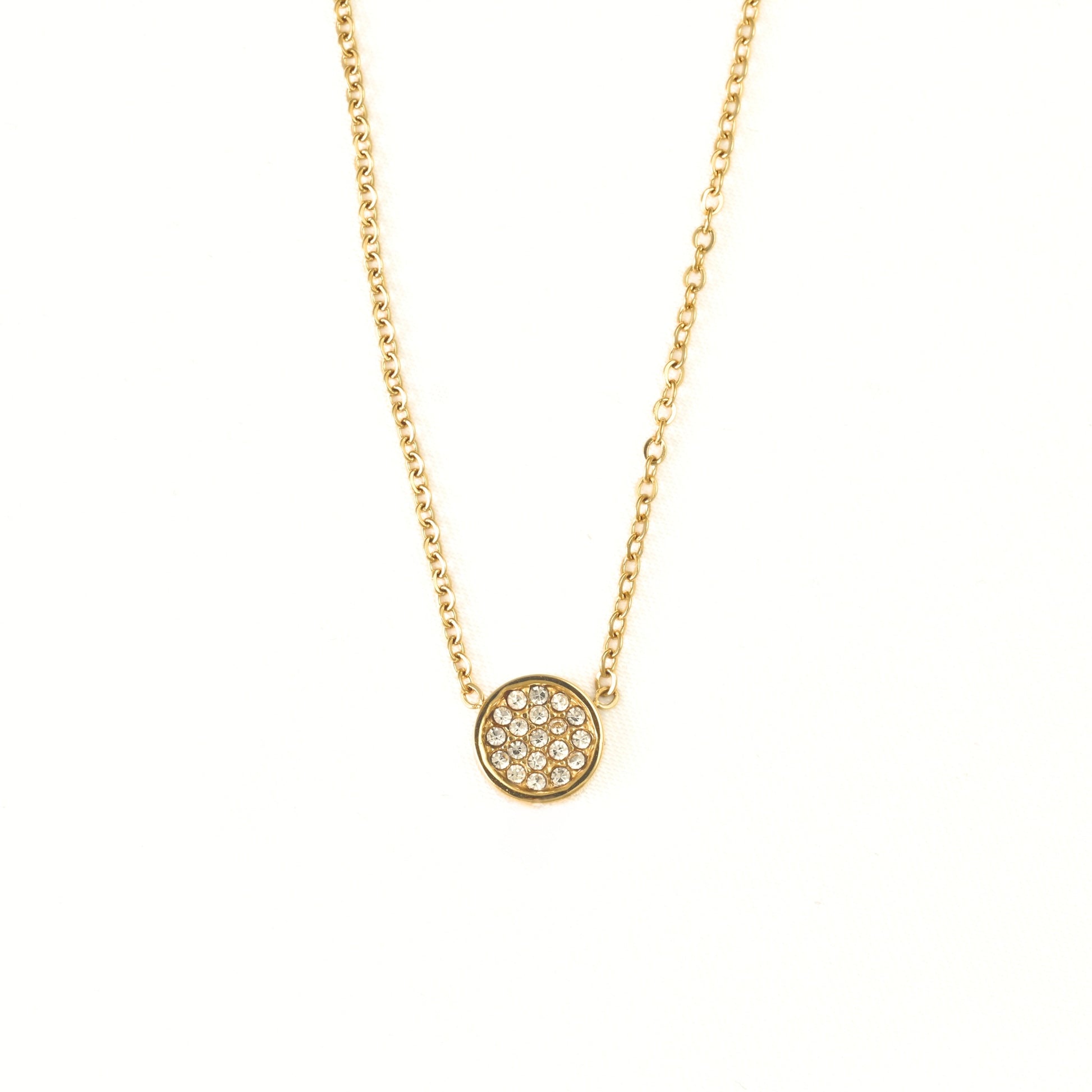 A delicate gold chain necklace with a small circular pendant paved with clear stones, displayed against a solid white background.