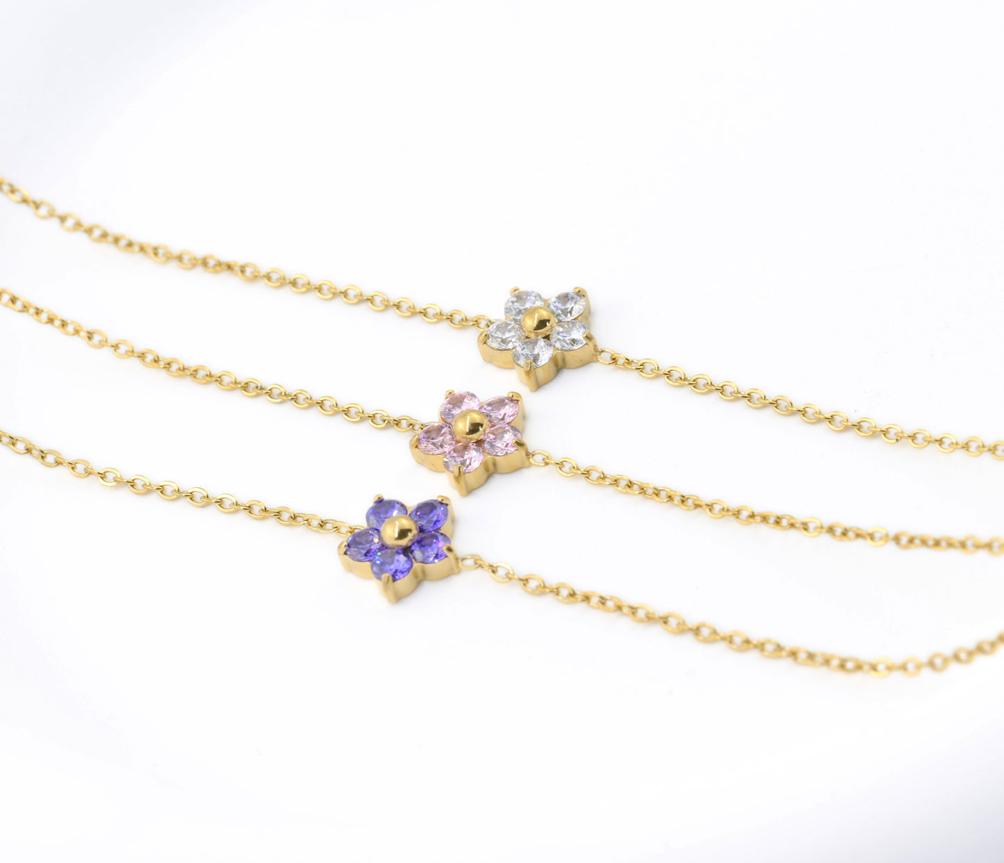 angled view of Three gold bracelets 
