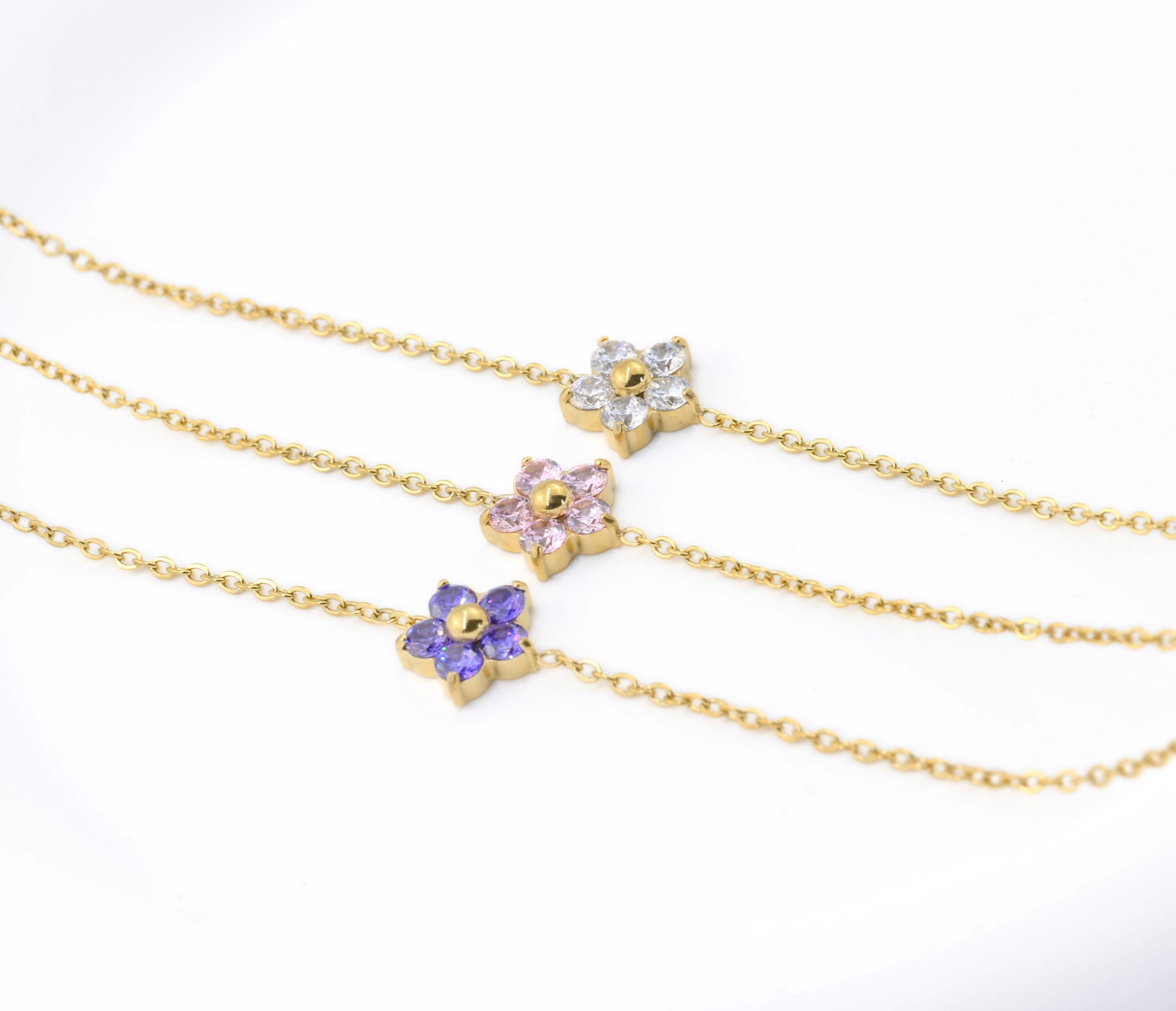 angled view of Three gold bracelets 