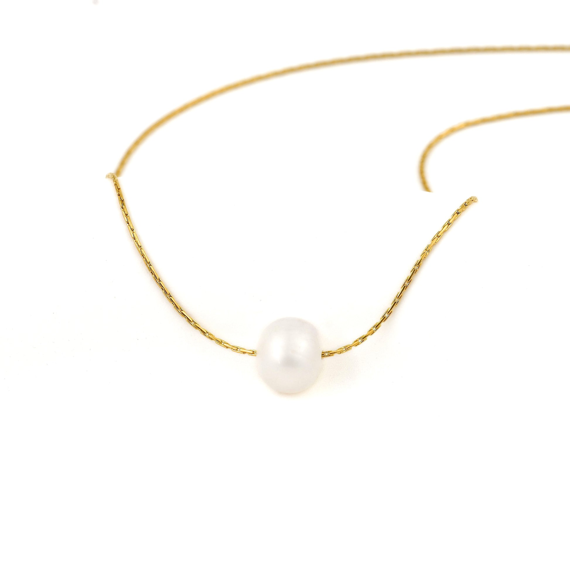 front view of a Gold necklace with a single pearl on a white background