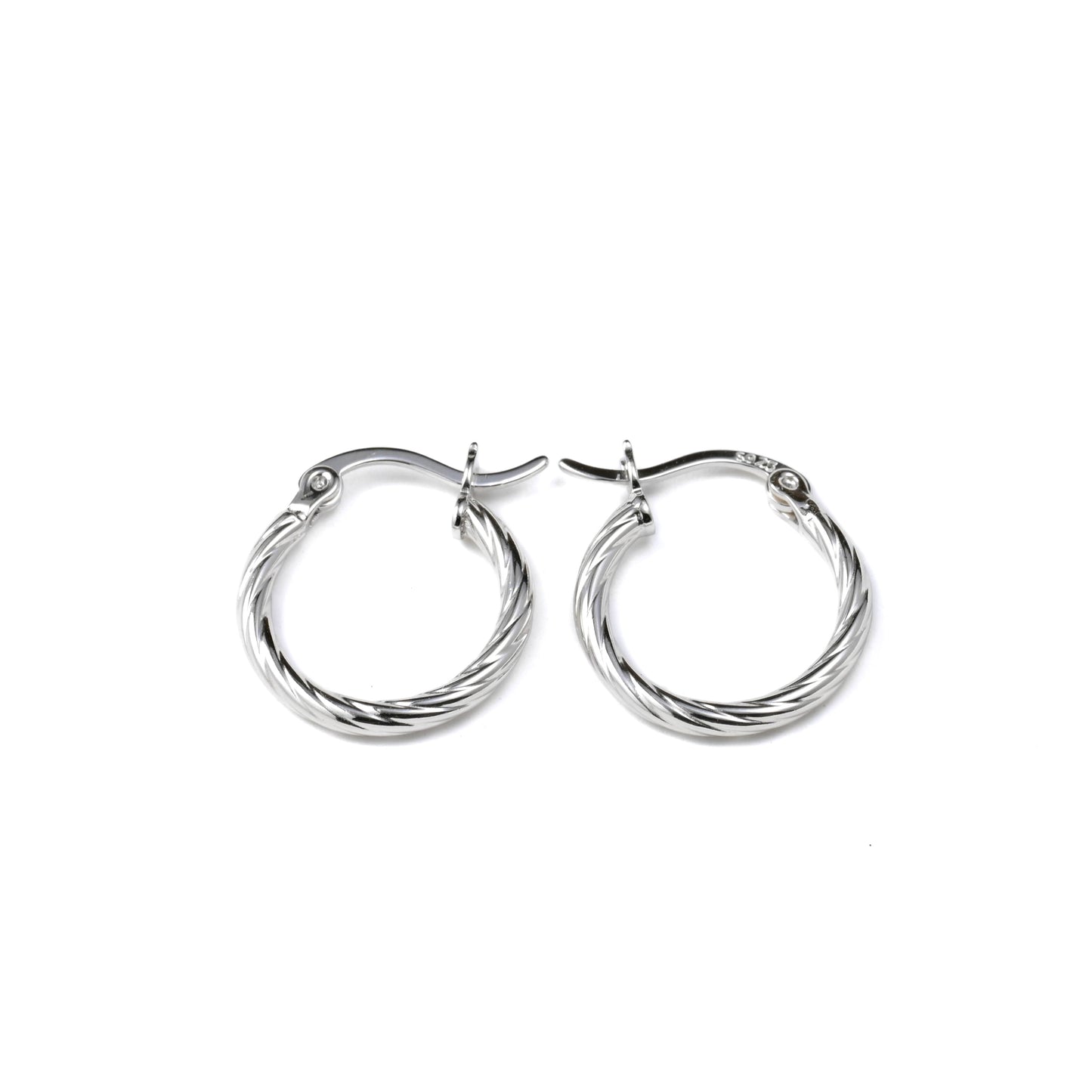 Pair of silver hoop earrings on a white background