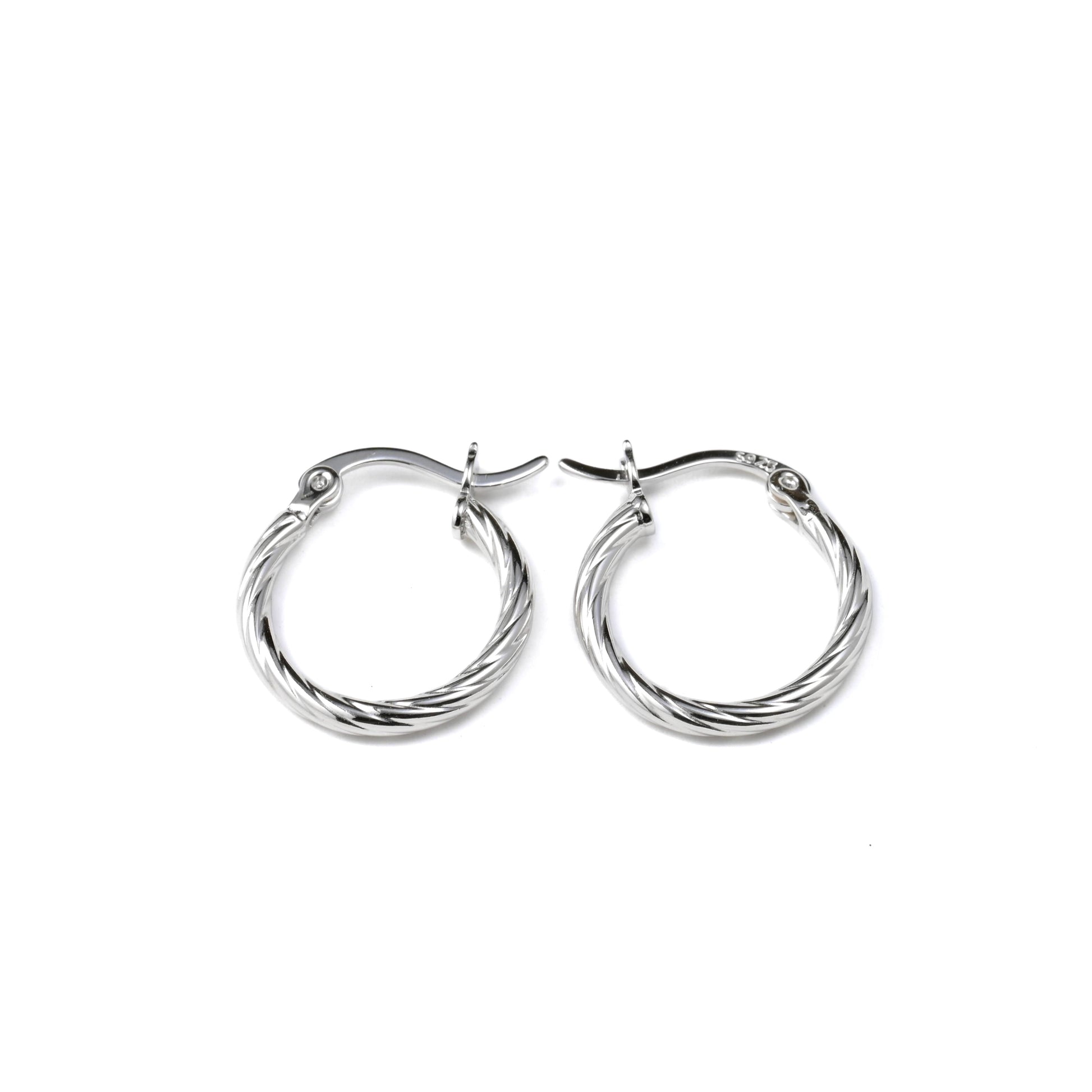 Pair of silver hoop earrings on a white background