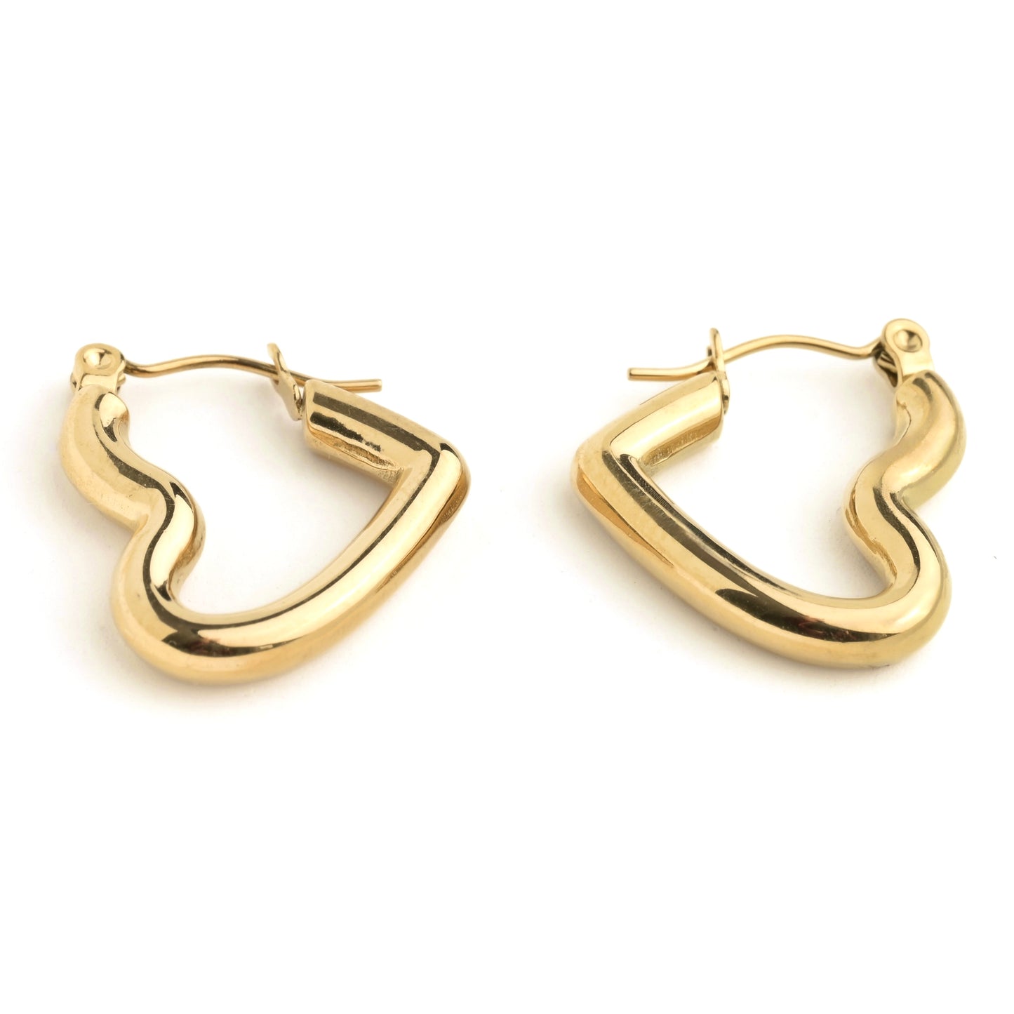 Thick Gold heart hoop earrings on a white background