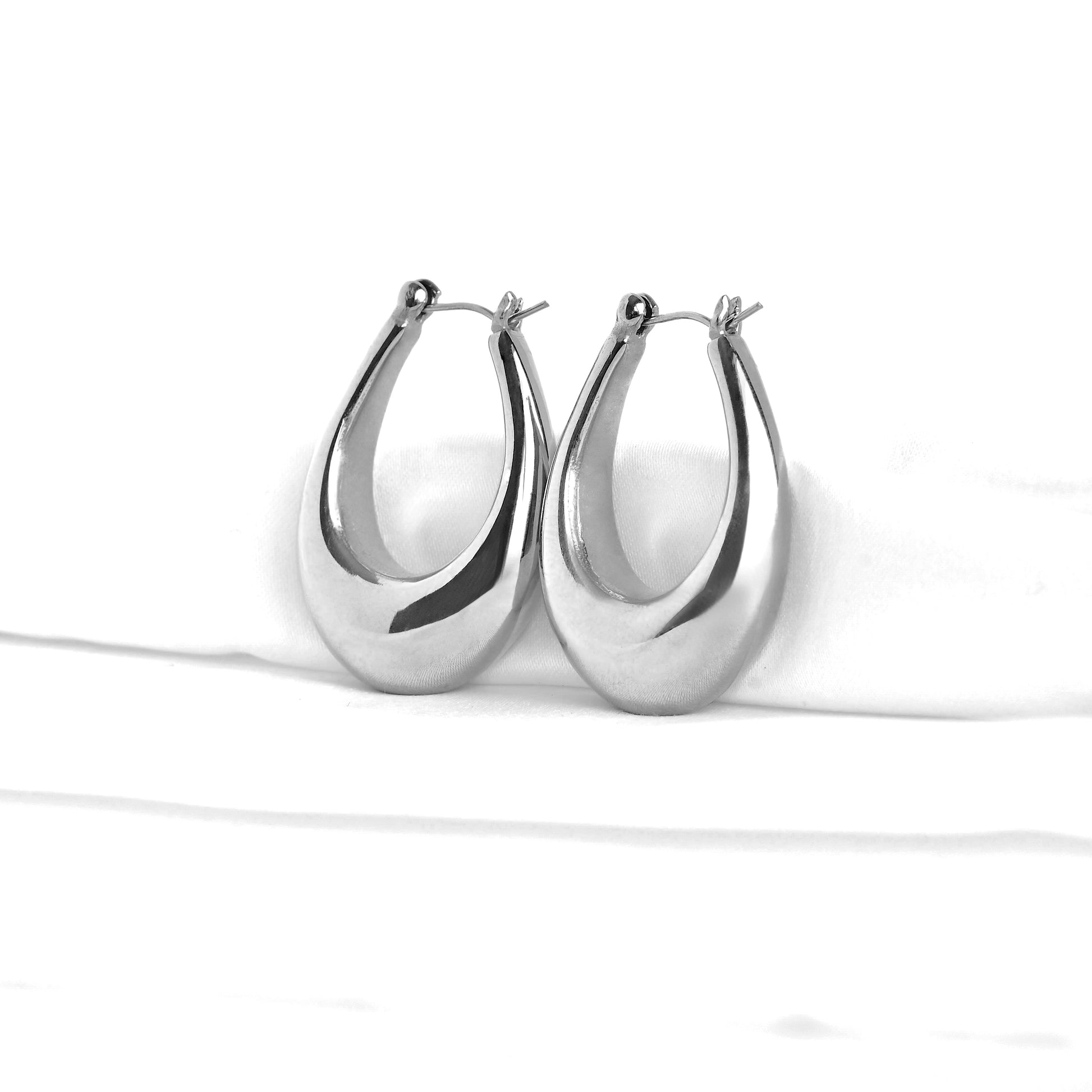 High-polished silver pear shaped hoop earrings