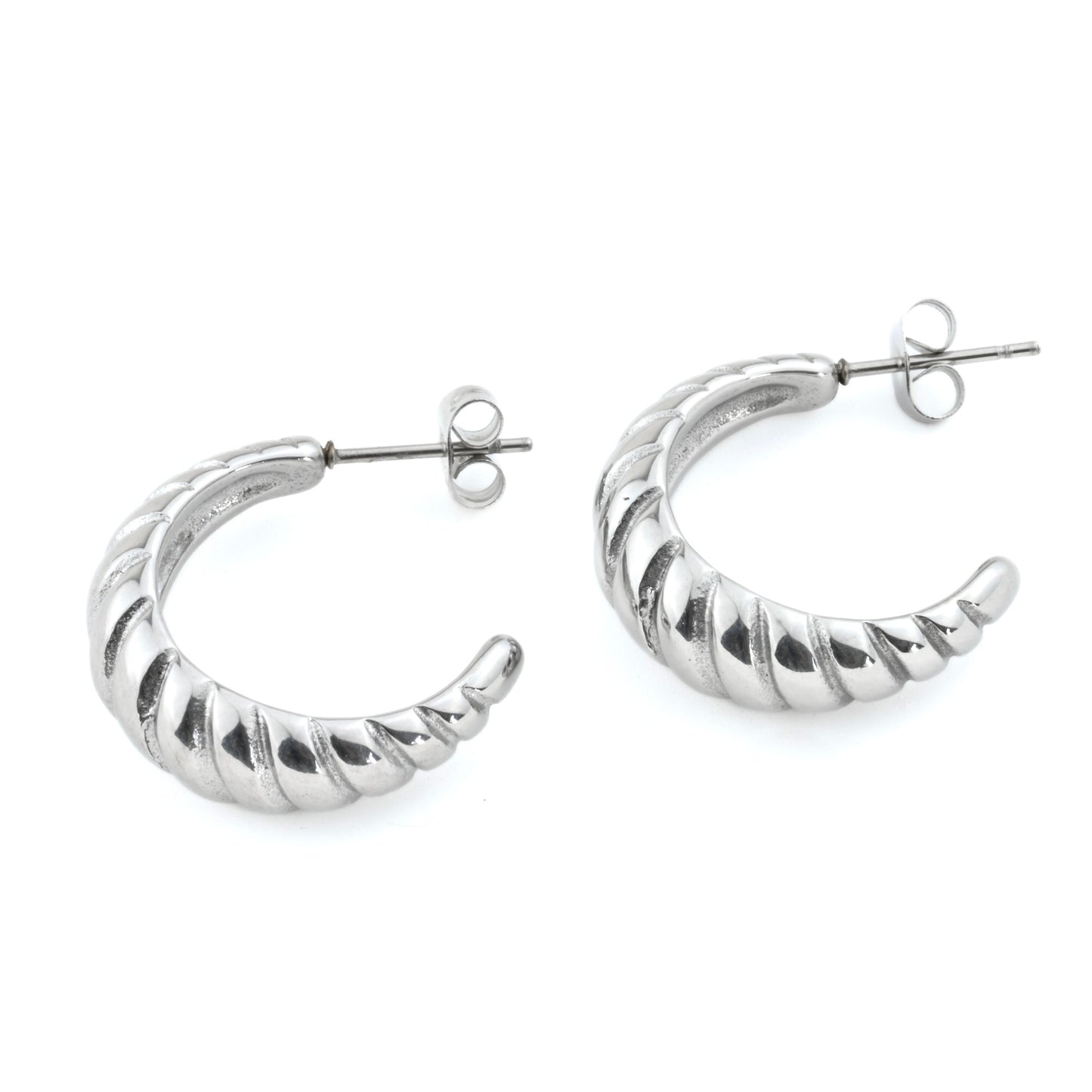 Silver hoop earrings with a ribbed texture on a white background