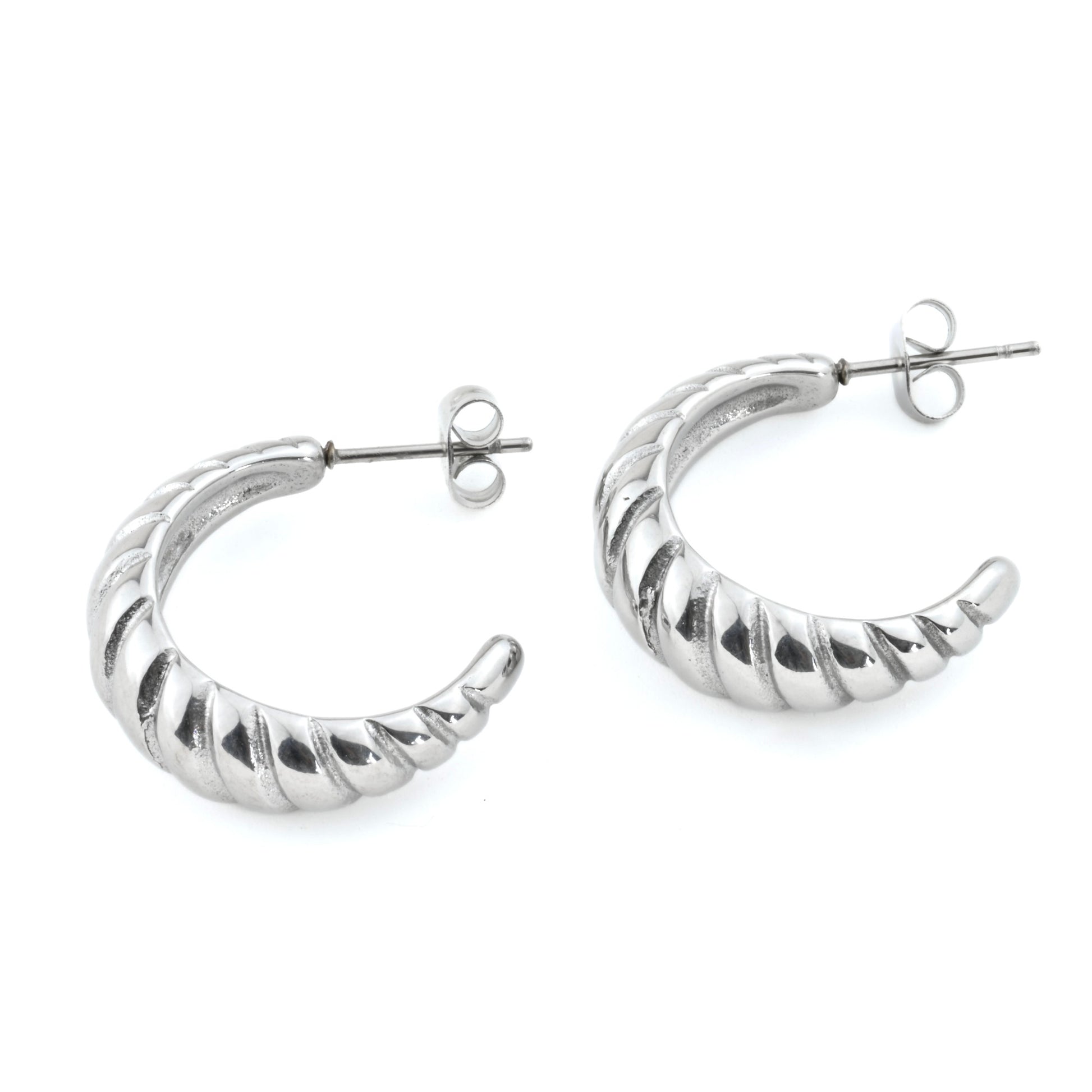 Silver hoop earrings with a ribbed texture on a white background