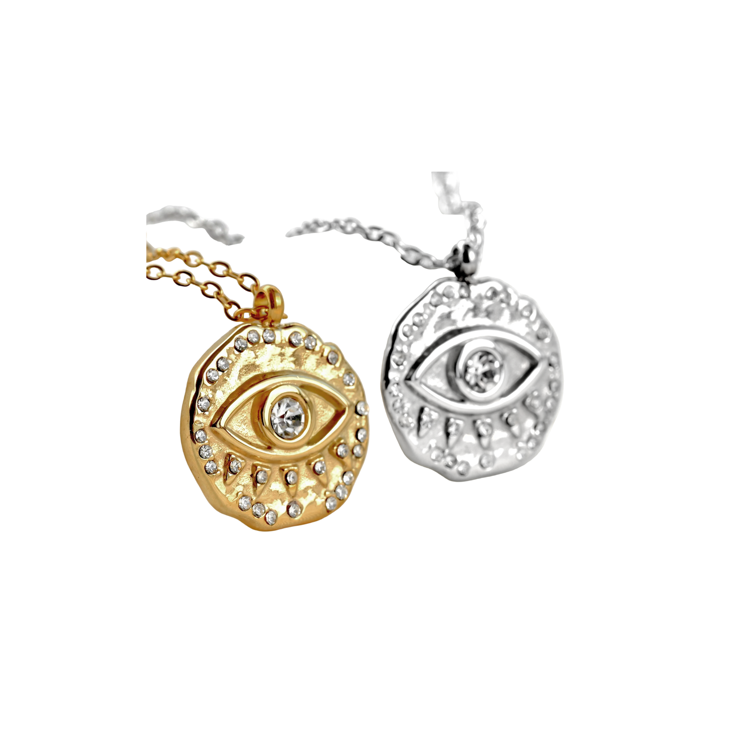 Gold and silver eye-shaped pendants on white background